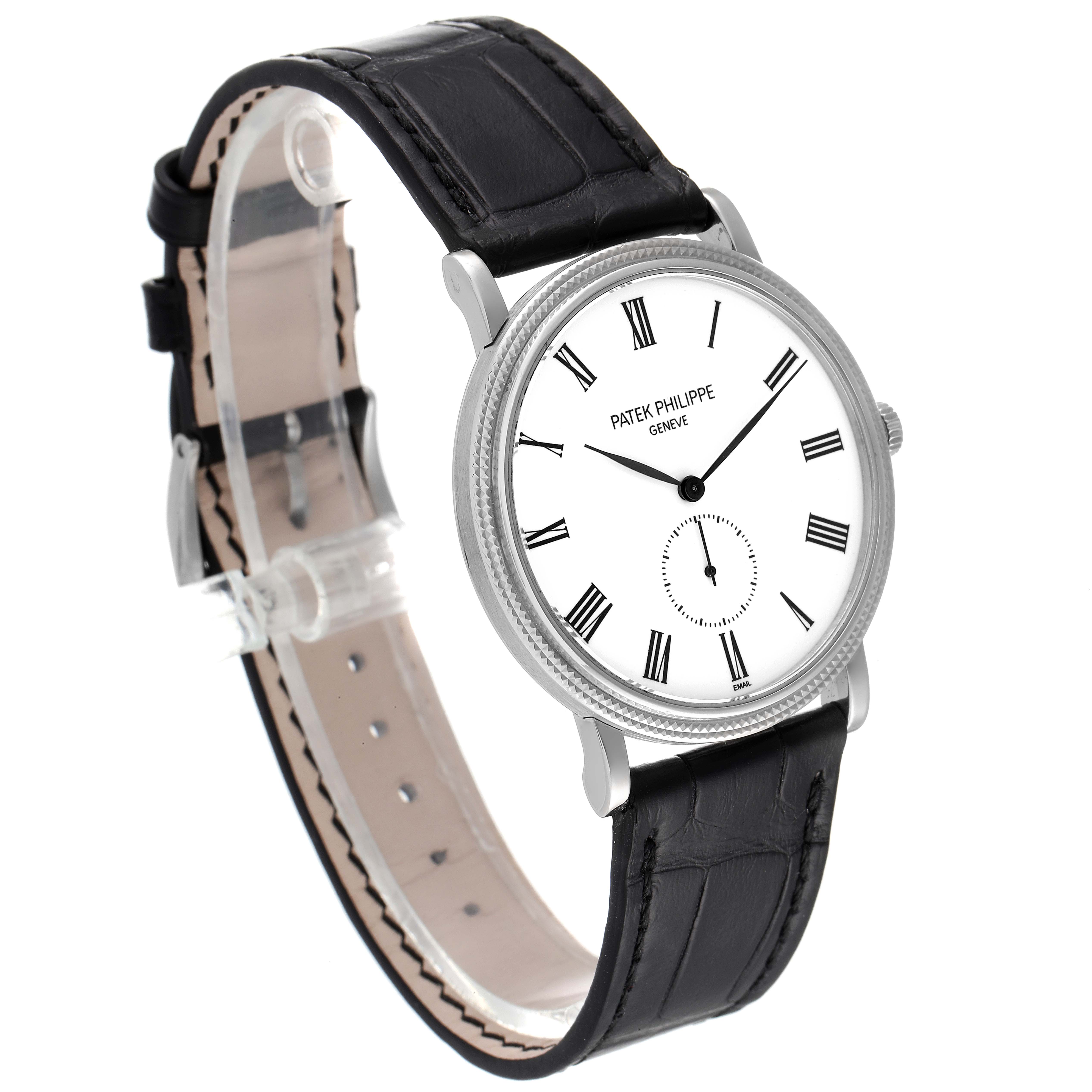 The image shows a side angle view of the Patek Philippe Calatrava 5116G Men
s White Gold White Dial 5116G Men
s White Gold White Dial watch, highlighting its white dial and black leather strap.