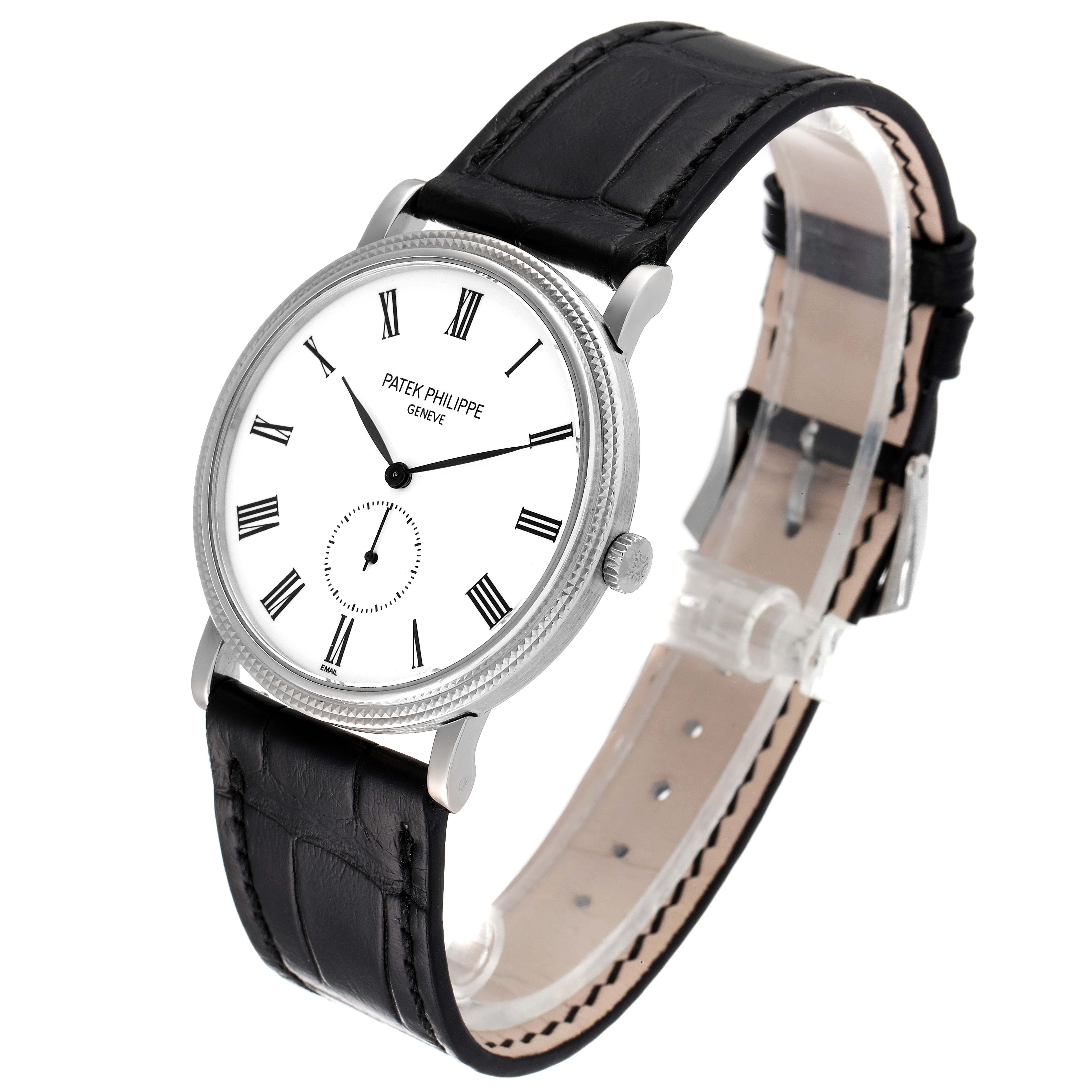 The image shows a Patek Philippe Calatrava 5116G Men
s White Gold White Dial 5116G Men
s White Gold White Dial watch viewed from a front oblique angle, highlighting its dial, case, and strap.