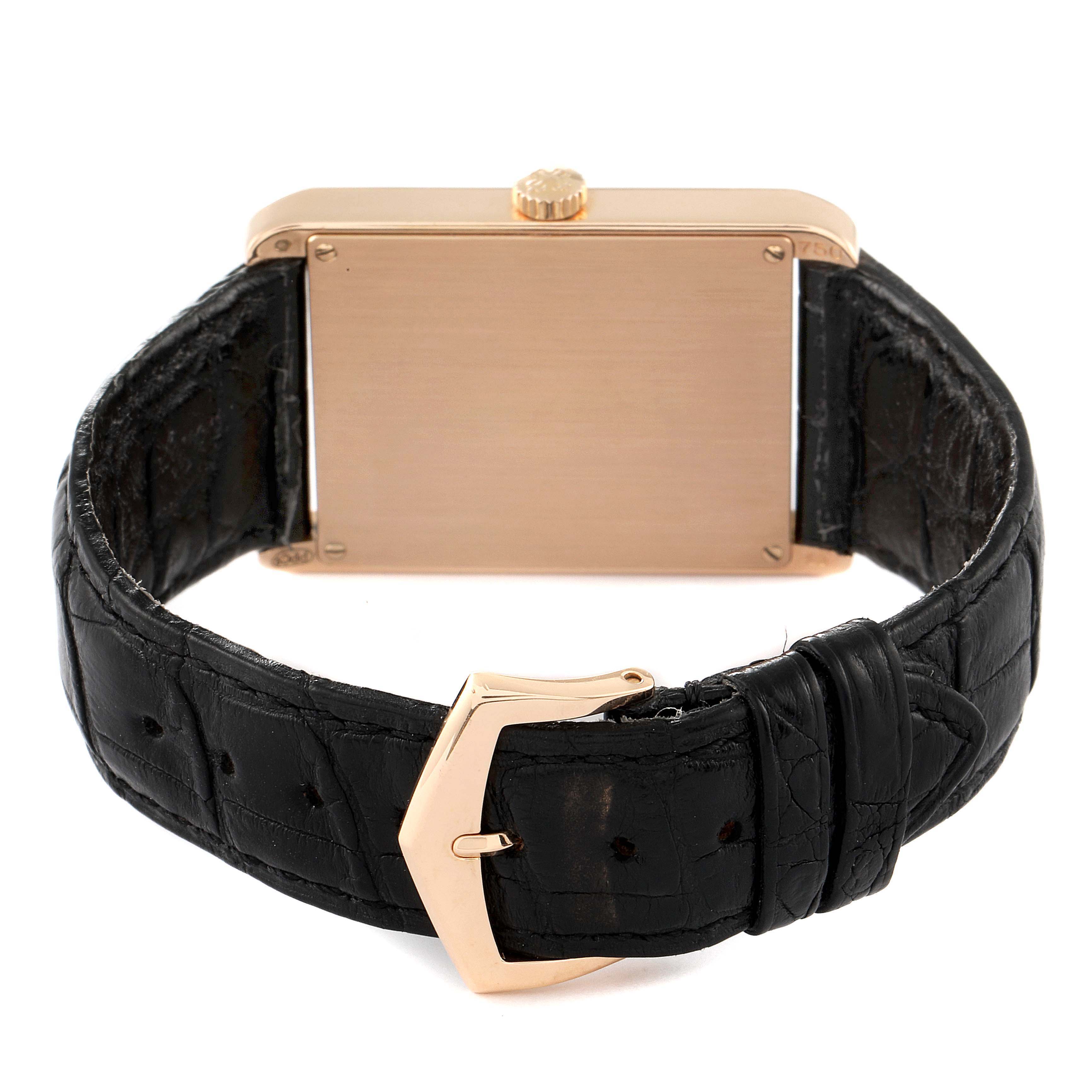 The image shows the back of a Patek Philippe Gondolo 5109R Men's Rose Gold Pink Dial 5109R Men's Rose Gold Pink Dial watch, highlighting its rectangular case, crown, and black leather strap with a buckle.