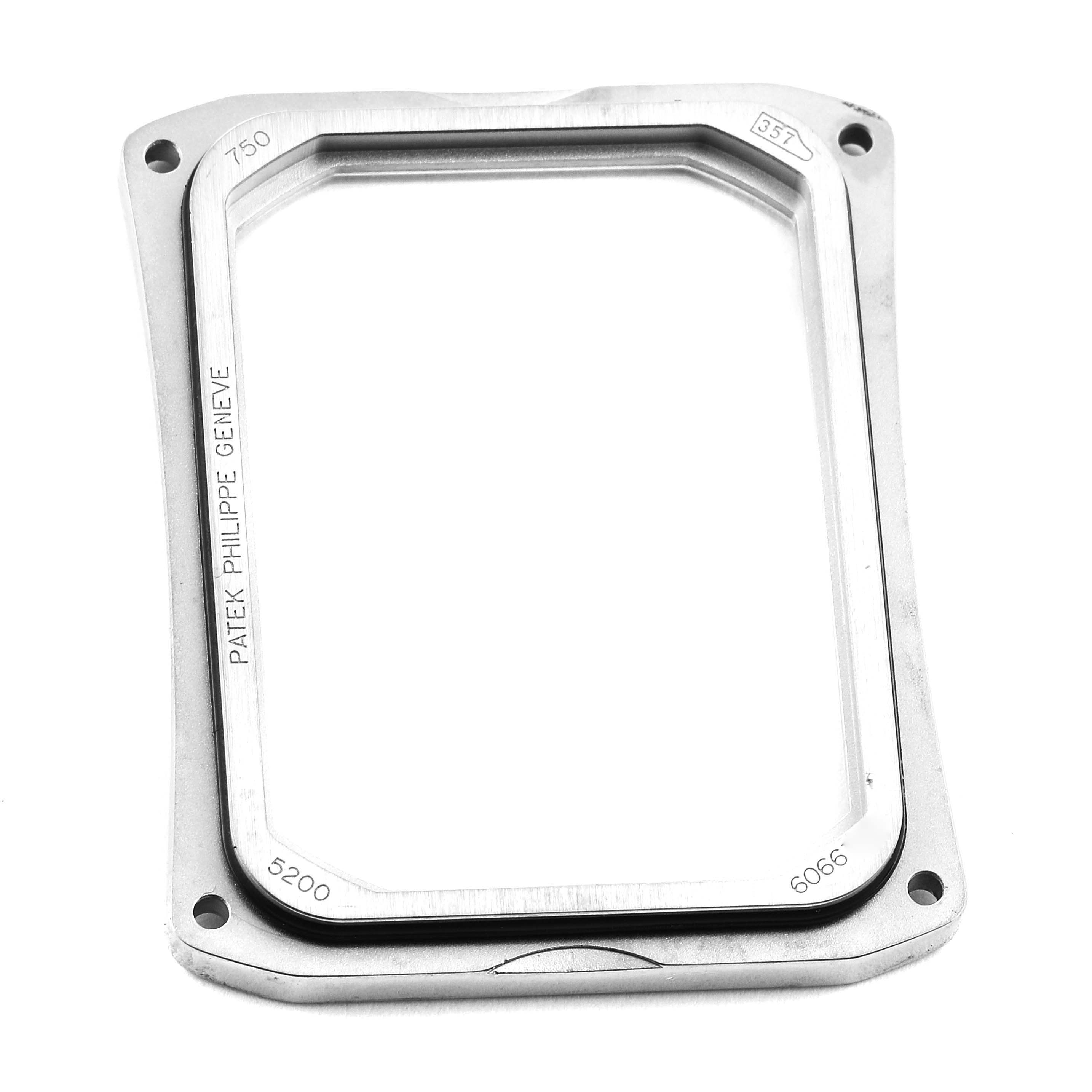 The image shows the bezel case of a Patek Philippe Gondolo 5200G-001 Men's White Gold Blue Dial 5200G-001 Men's White Gold Blue Dial watch from a top-down angle.