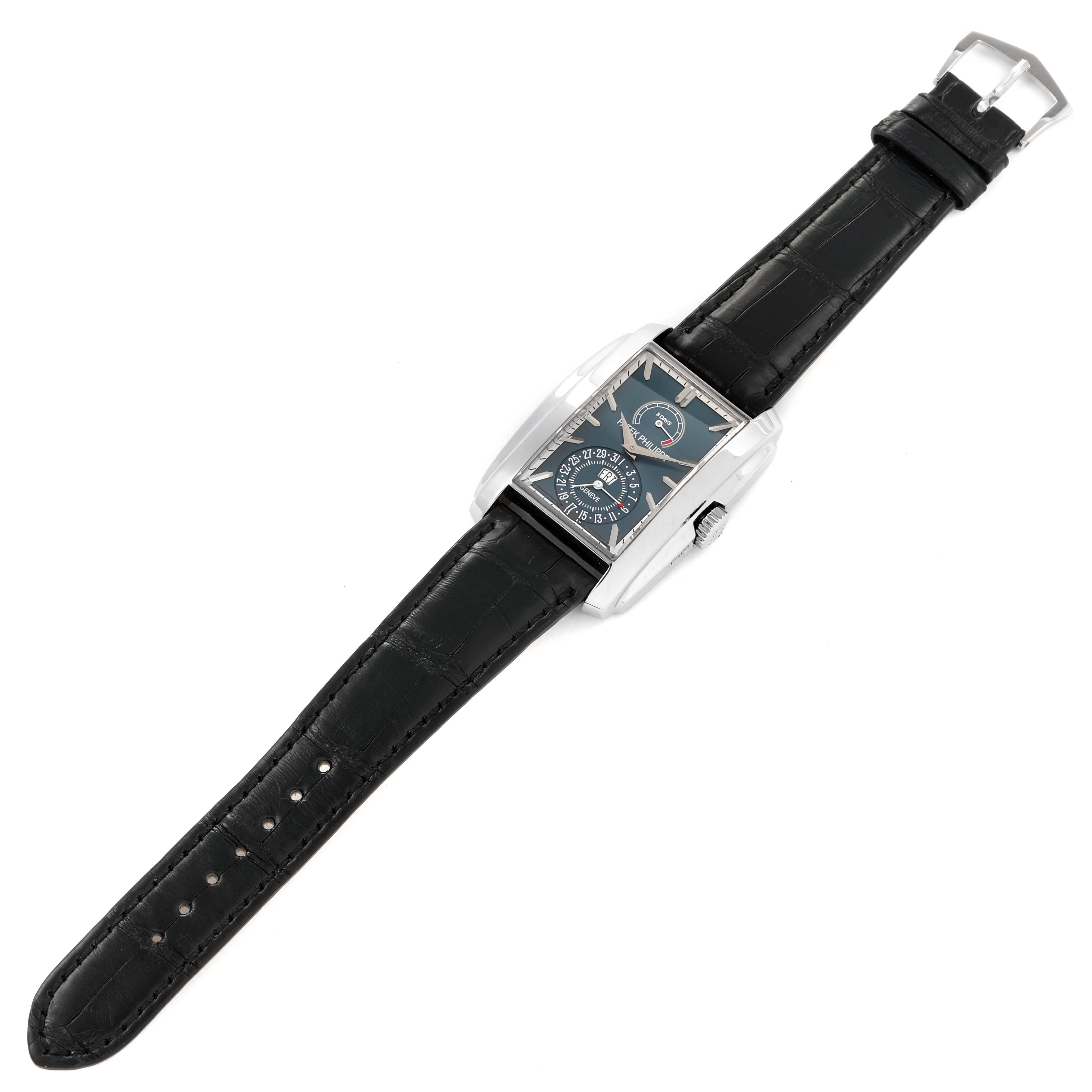 This image shows a Patek Philippe Gondolo 5200G-001 Men's White Gold Blue Dial 5200G-001 Men's White Gold Blue Dial watch from a top-down angle, displaying the entire watch including the face, case, strap, and buckle.