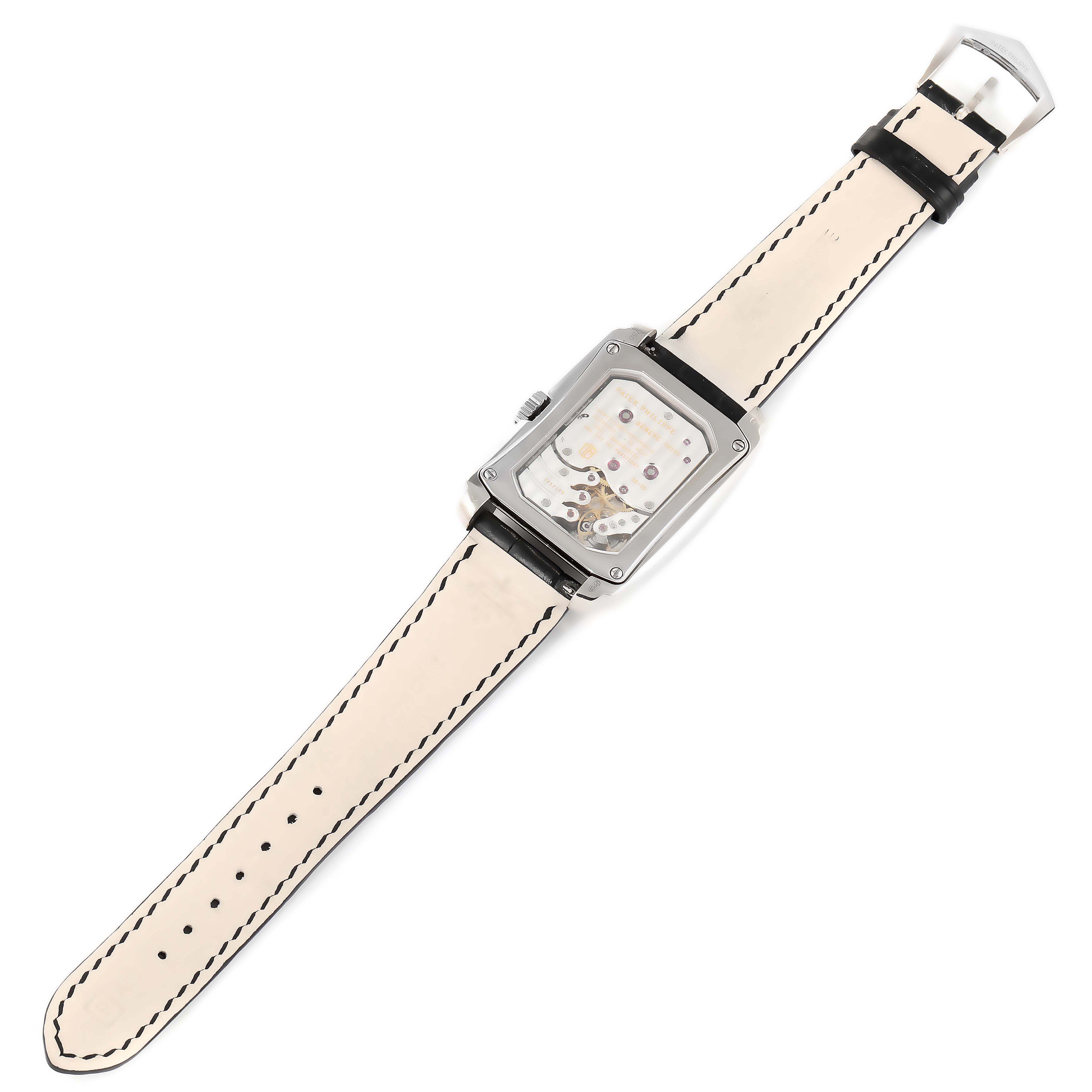 The image shows a Patek Philippe Gondolo 5200G-001 Men's White Gold Blue Dial 5200G-001 Men's White Gold Blue Dial watch from a top-down angle, highlighting its face, case, and strap.