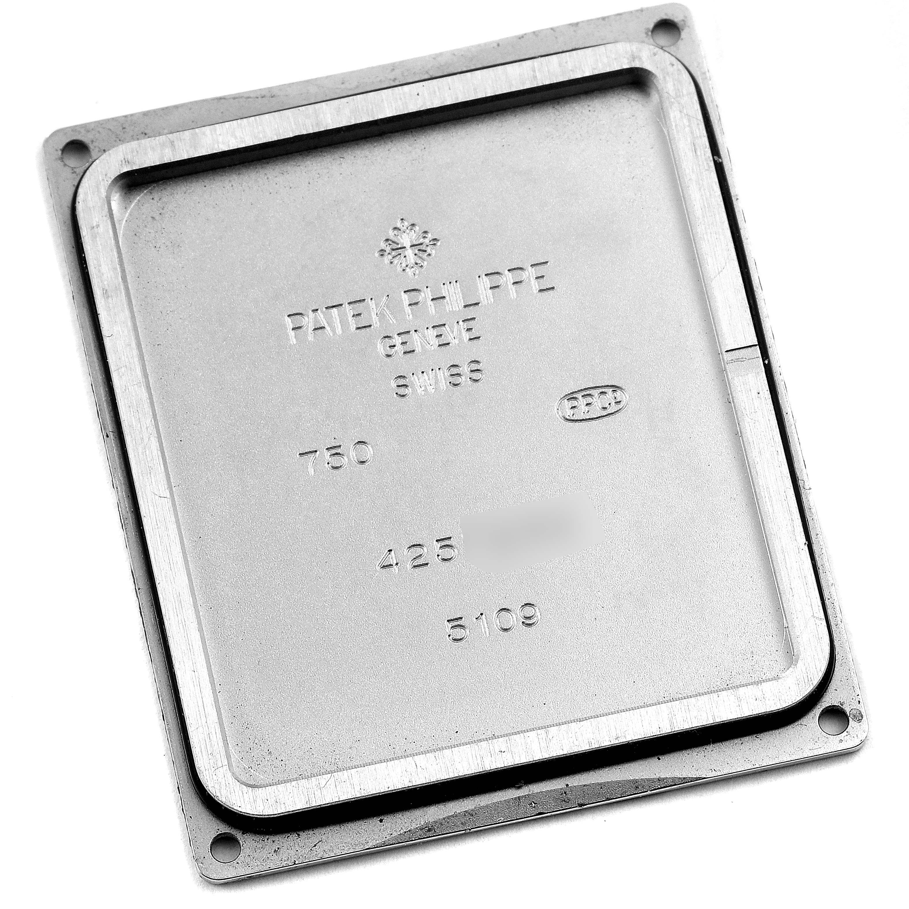 The image shows the inside case back of a Patek Philippe Gondolo 5109G Men
s White Gold Silver Dial 5109G Men
s White Gold Silver Dial watch model, photographed from a top-down angle.