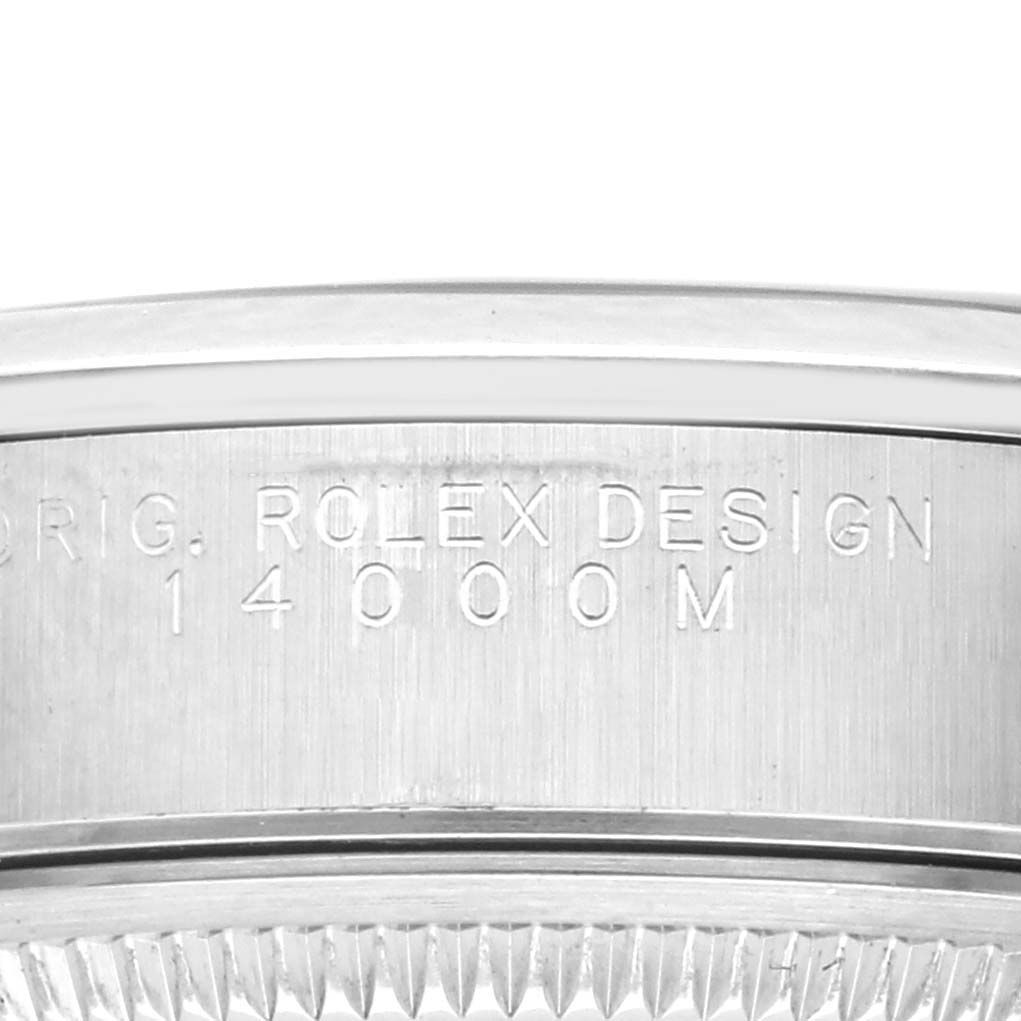 The image shows a close-up of the side of a Rolex Air-King 14000M Men's Stainless Steel Blue Dial 14000M Men's Stainless Steel Blue Dial watch, highlighting engraved text and part of the bezel.