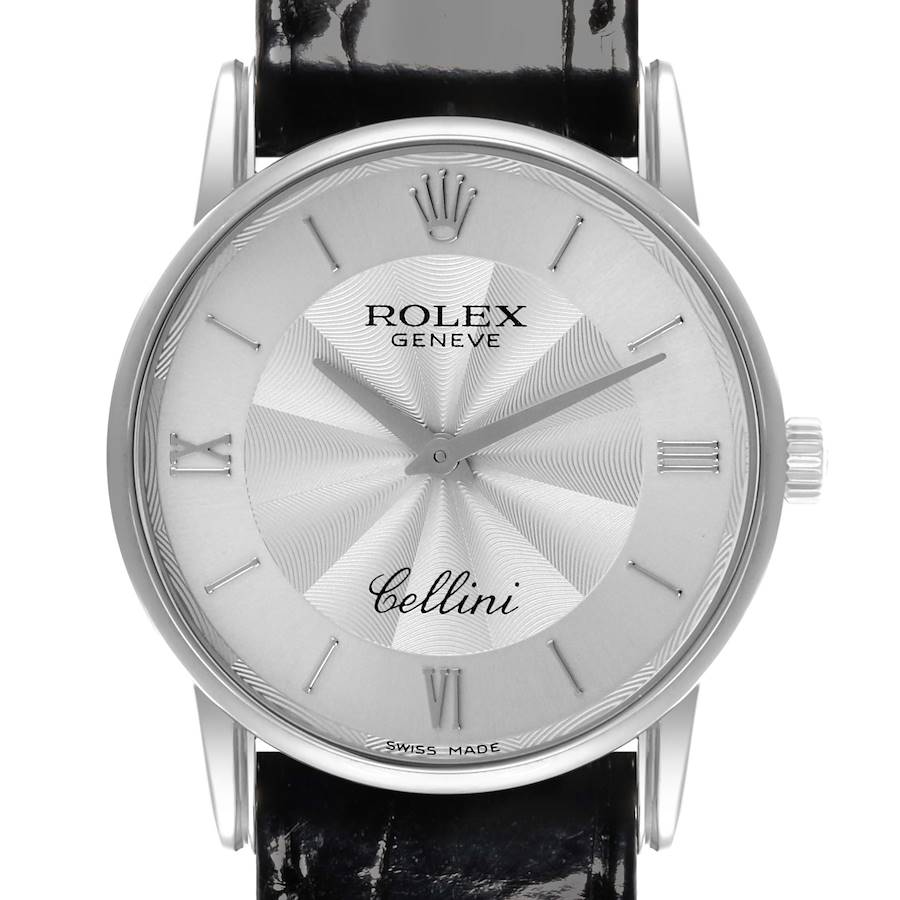 The Rolex Cellini watch is shown from a frontal angle, highlighting its dial, hands, markers, and part of the leather strap.