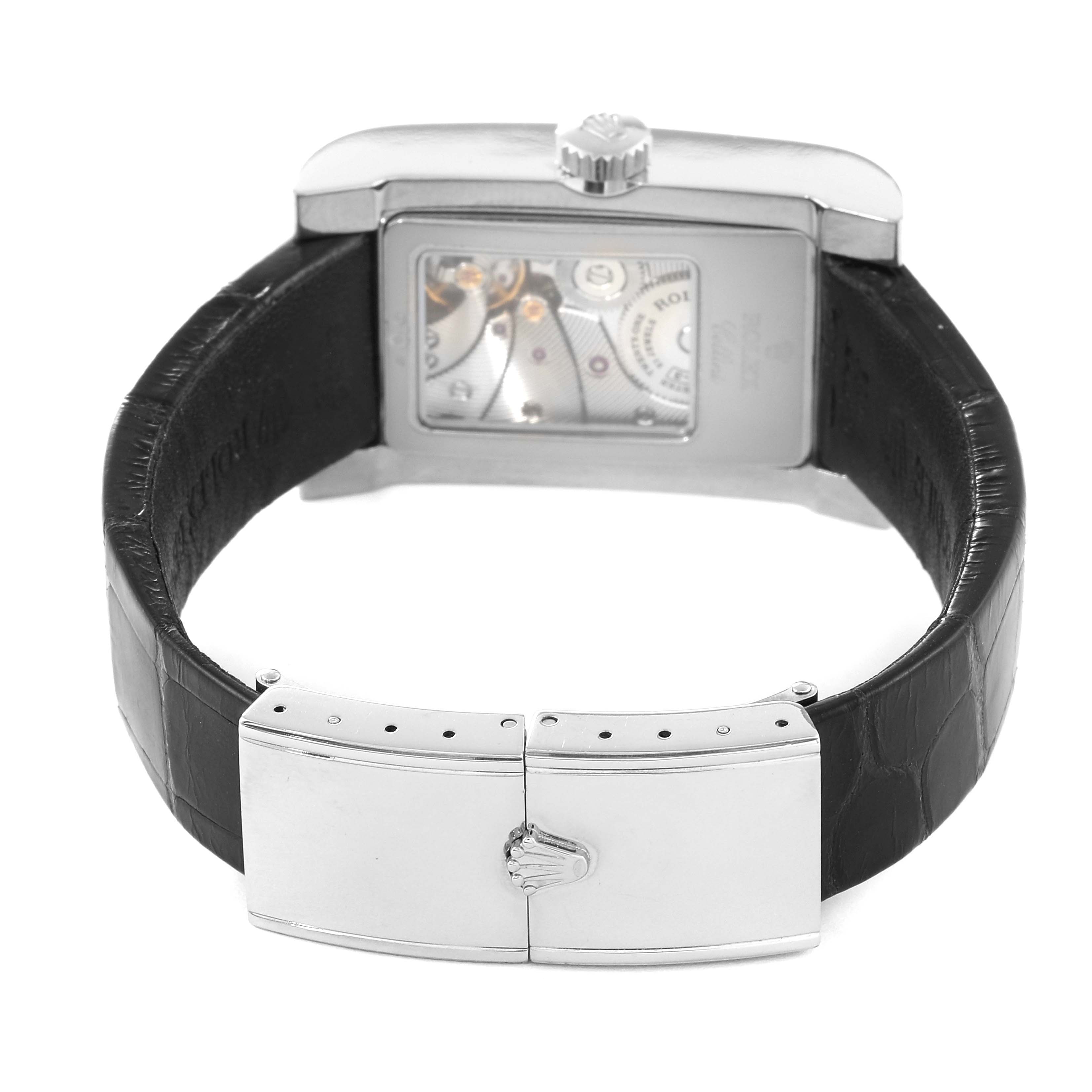 The image shows the back of a Rolex Cellini 5441/9 Men
s White Gold Silver Dial 5441/9 Men
s White Gold Silver Dial watch, highlighting the clasp, leather strap, and transparent case back with visible movement.