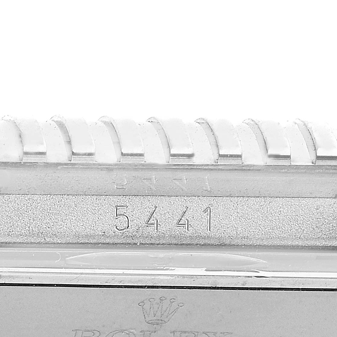 This close-up view shows the bezel details and serial number of the Rolex Cellini 5441/9 Men
s White Gold Silver Dial 5441/9 Men
s White Gold Silver Dial model watch.