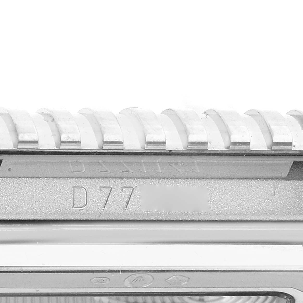This image shows a close-up of the side of the bezel and serial number of a Rolex Cellini 5441/9 Men
s White Gold Silver Dial 5441/9 Men
s White Gold Silver Dial watch.