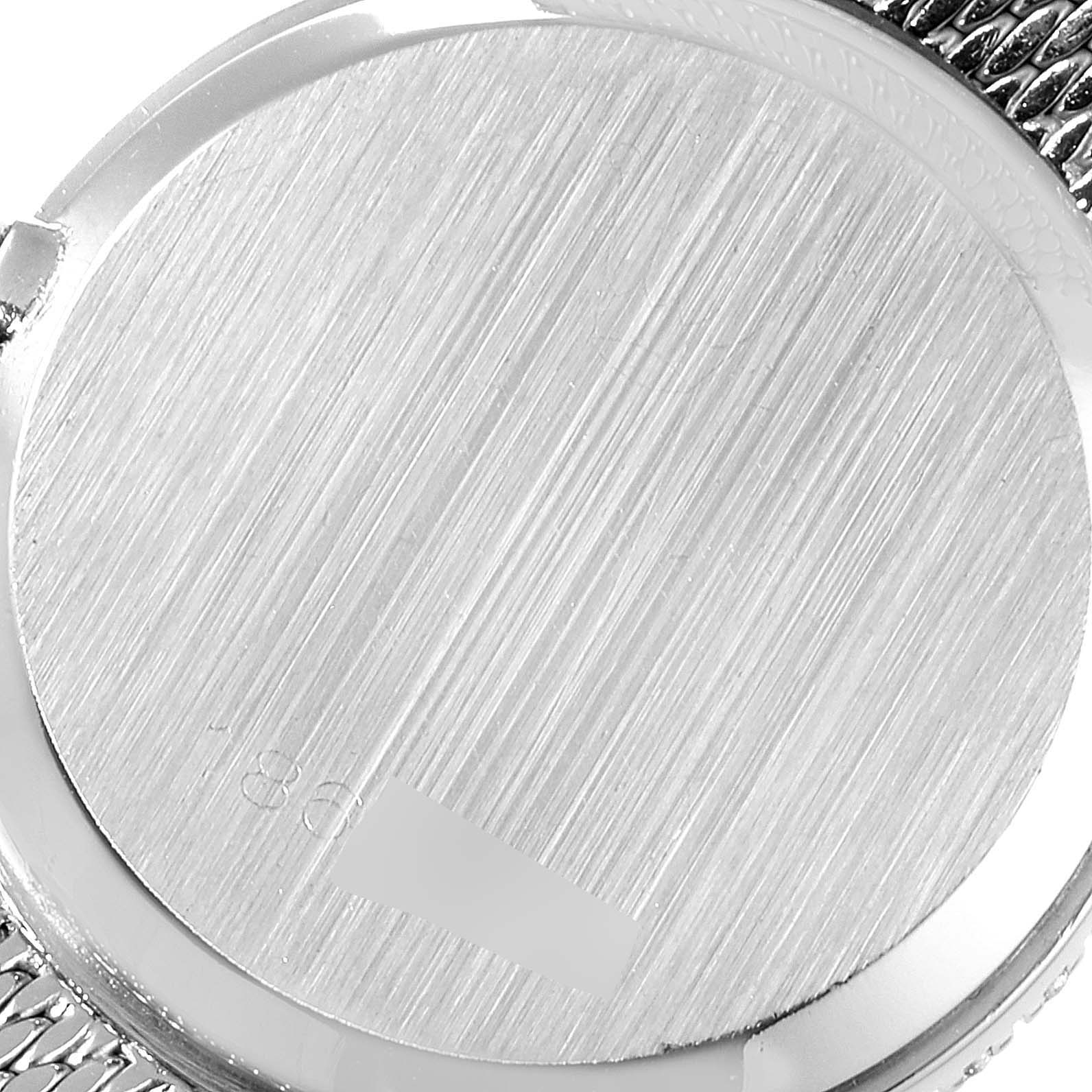 The image shows the case back of the Rolex Cocktail 3812 Women
s White Gold Blue Dial 3812 Women
s White Gold Blue Dial watch from an angled top view, highlighting its brushed finish.