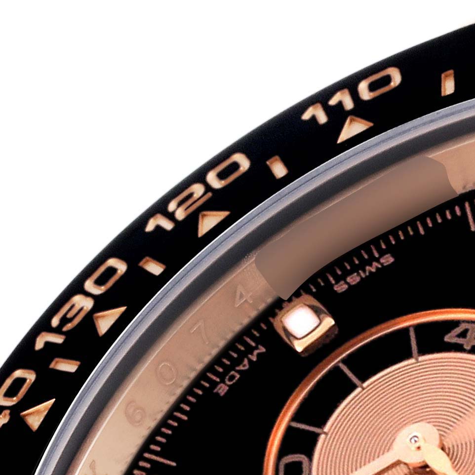 The image shows a close-up of the bezel and part of the dial on a Rolex Daytona 116515LN Men
s Rose Gold Silver Dial 116515LN Men
s Rose Gold Silver Dial watch.