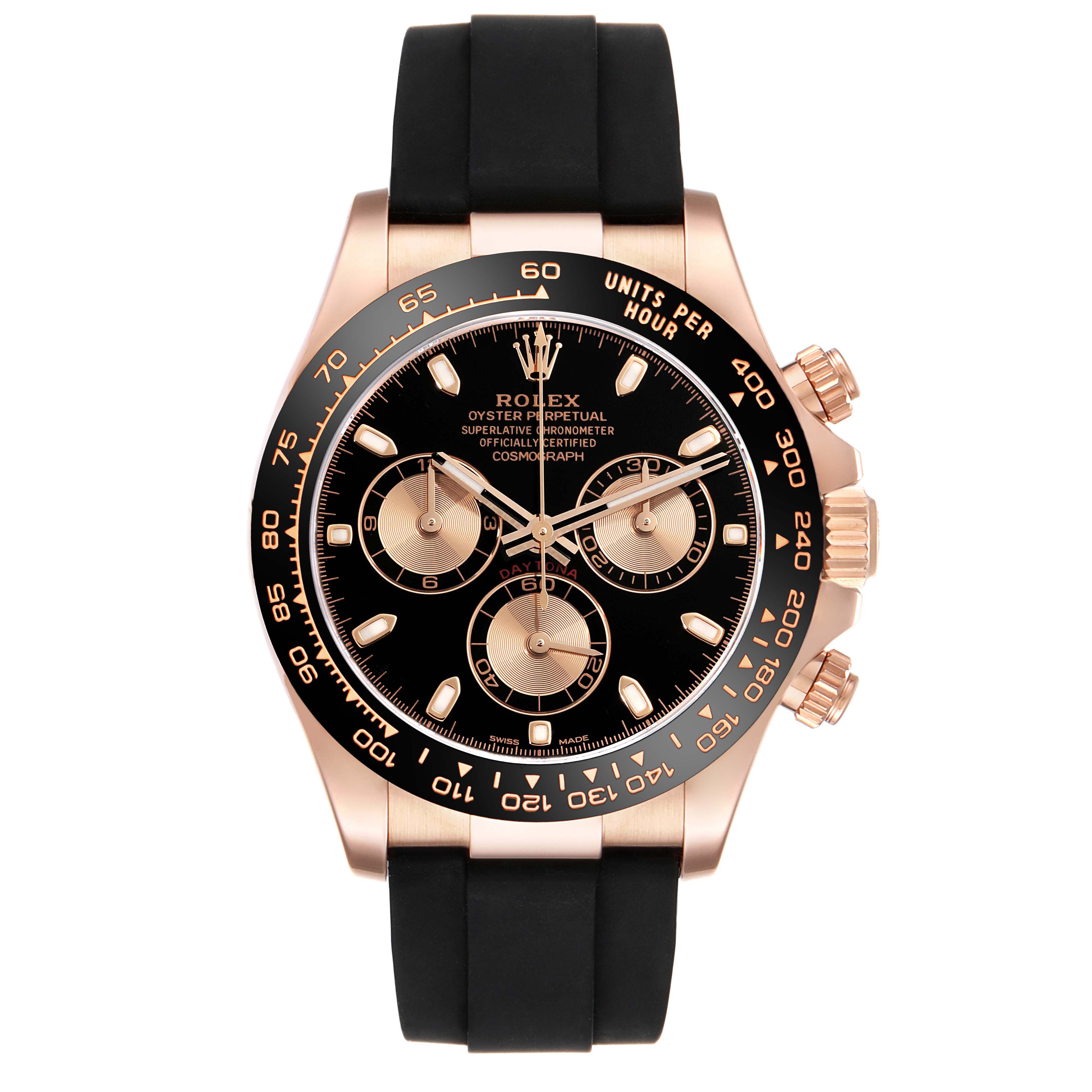 The image shows a Rolex Daytona 116515LN Men
s Rose Gold Silver Dial 116515LN Men
s Rose Gold Silver Dial watch from a front view, highlighting its black dial, gold sub-dials, black bezel, and black strap.