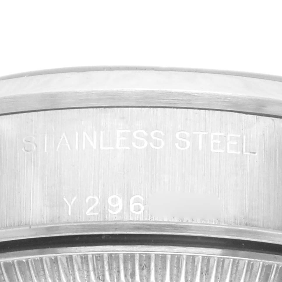 The image shows a close-up of the side, focusing on the stainless steel part and serial engraving of a Rolex Date 79160 Women's Stainless Steel White Dial 79160 Women's Stainless Steel White Dial watch.