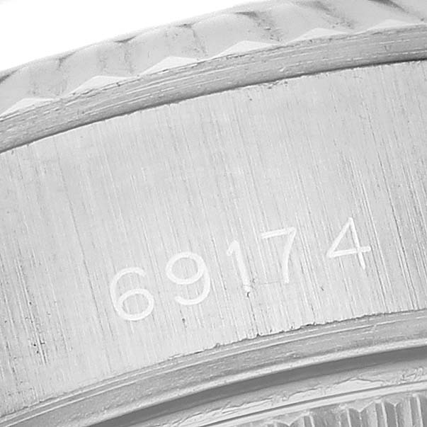 The image shows a close-up of the model number engraving (69174) on a Rolex Datejust 69174 Women's Stainless Steel White Dial 69174 Women's Stainless Steel White Dial watch bezel.