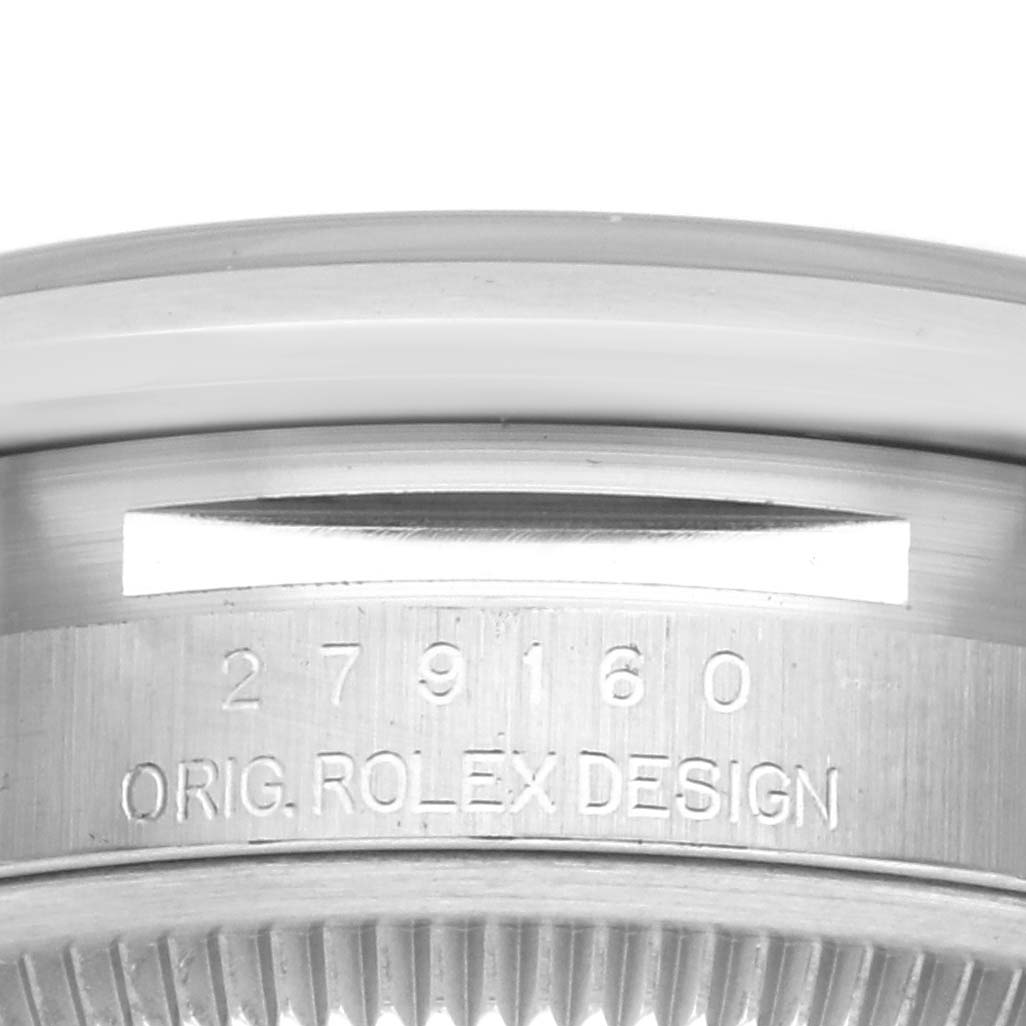 The image shows a close-up of the Datejust Rolex watch's brushed metal case with engraving "ORIG. ROLEX DESIGN."
