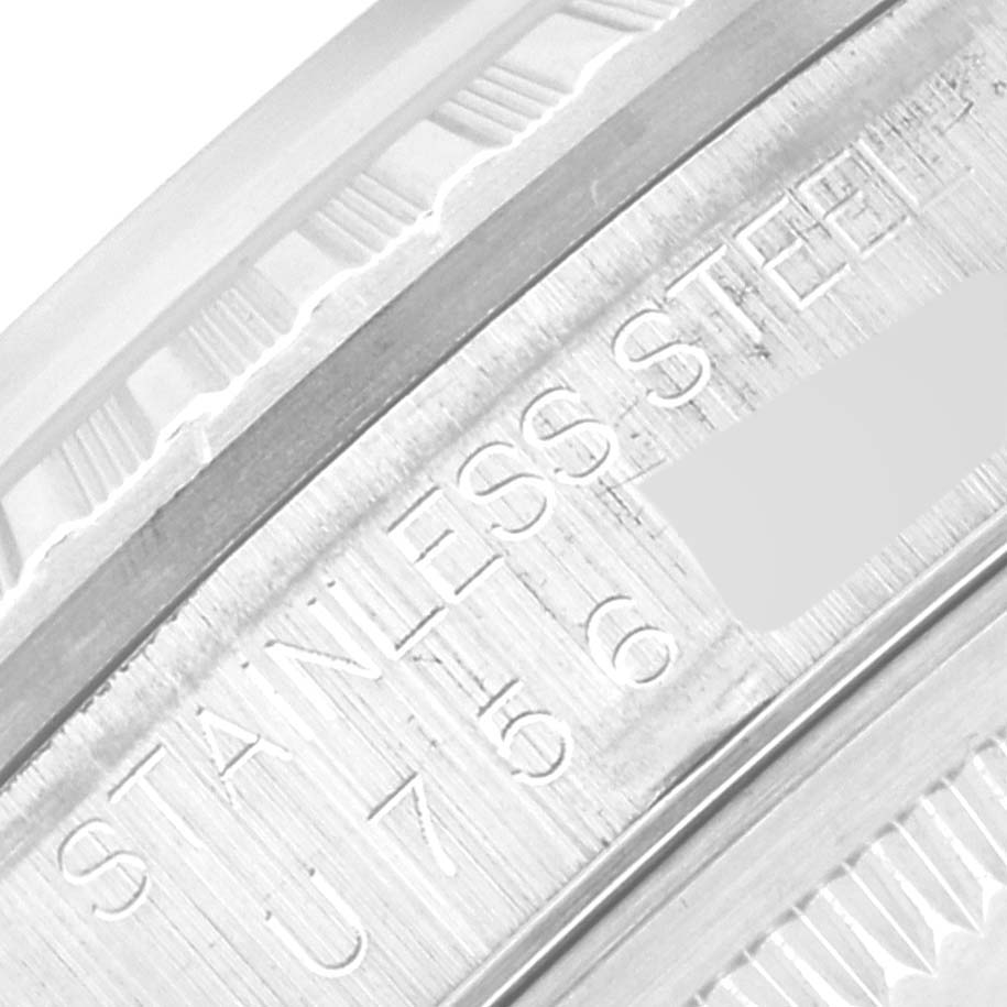 This image shows an up-close view of the engraving on the inner bezel of the Rolex Datejust 16220 Men's Stainless Steel Pink Dial 16220 Men's Stainless Steel Pink Dial watch.