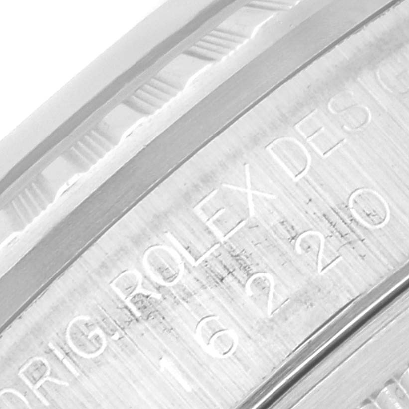 The image shows a close-up of the engraved text on the bezel of a Rolex Datejust 16220 Men's Stainless Steel Pink Dial 16220 Men's Stainless Steel Pink Dial watch.