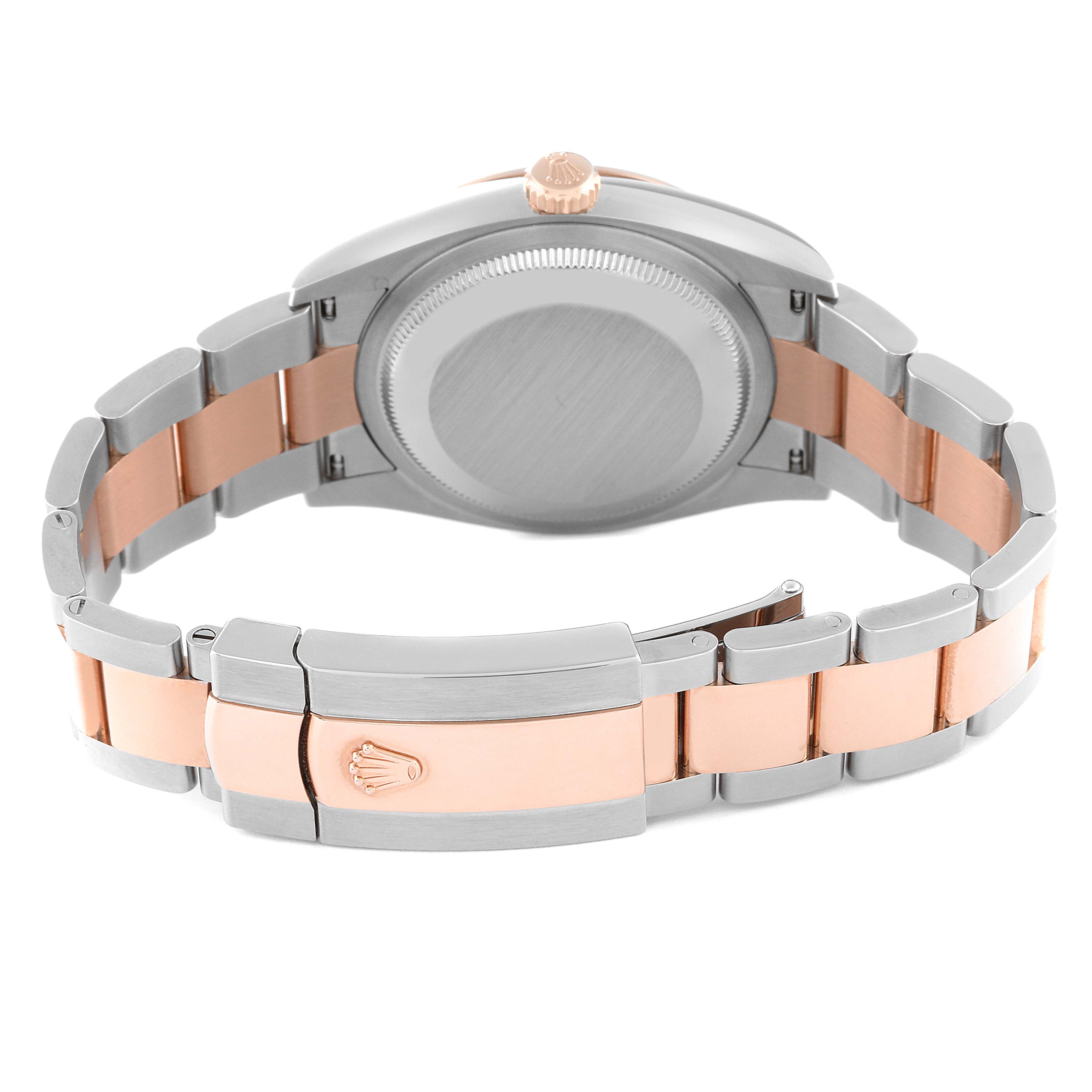 The image shows the back side of the Rolex Datejust 126201 Men's Steel and Gold (two tone) Grey Dial 126201 Men's Steel and Gold (two tone) Grey Dial watch featuring its bracelet clasp and case back.