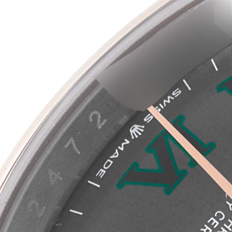 This close-up angle of the Rolex Datejust 126201 Men's Steel and Gold (two tone) Grey Dial 126201 Men's Steel and Gold (two tone) Grey Dial watch shows part of the dial, including the "Swiss Made" marking, VI numeral, and minute indices.