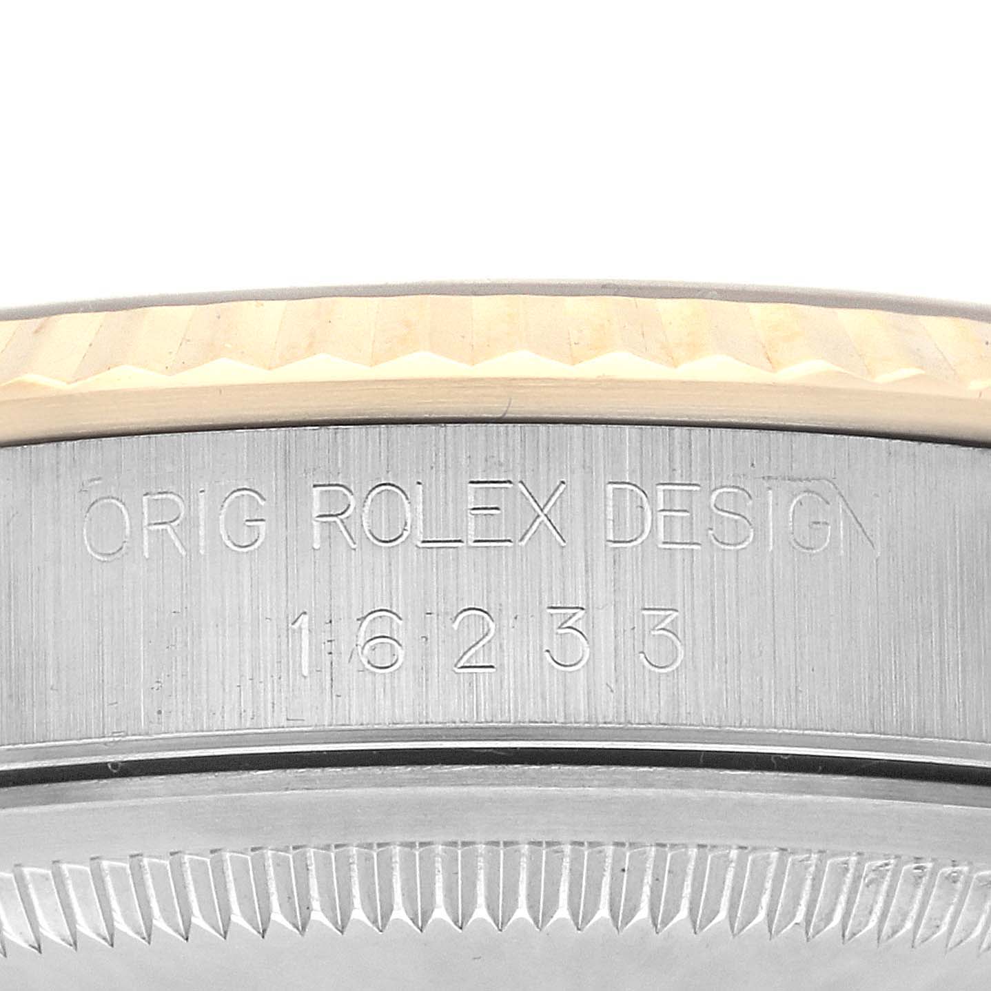 The image shows a close-up of the case side with engraved design details of the Rolex Datejust 16233 Men's Steel and Gold (two tone) Champagne Dial 16233 Men's Steel and Gold (two tone) Champagne Dial.