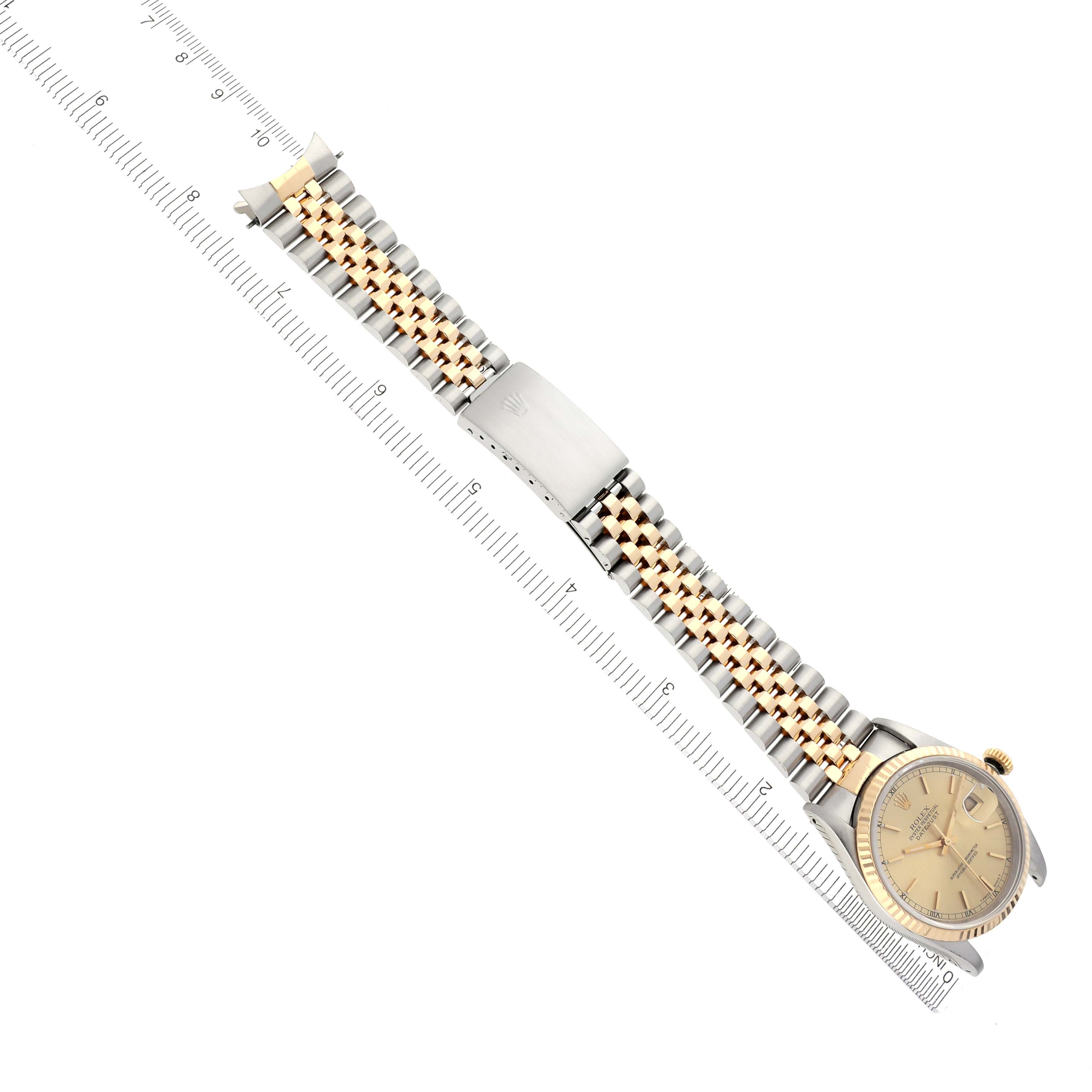 The Rolex Datejust 16233 Men's Steel and Gold (two tone) Champagne Dial 16233 Men's Steel and Gold (two tone) Champagne Dial watch is displayed diagonally, showing the full bracelet, clasp, and watch face.