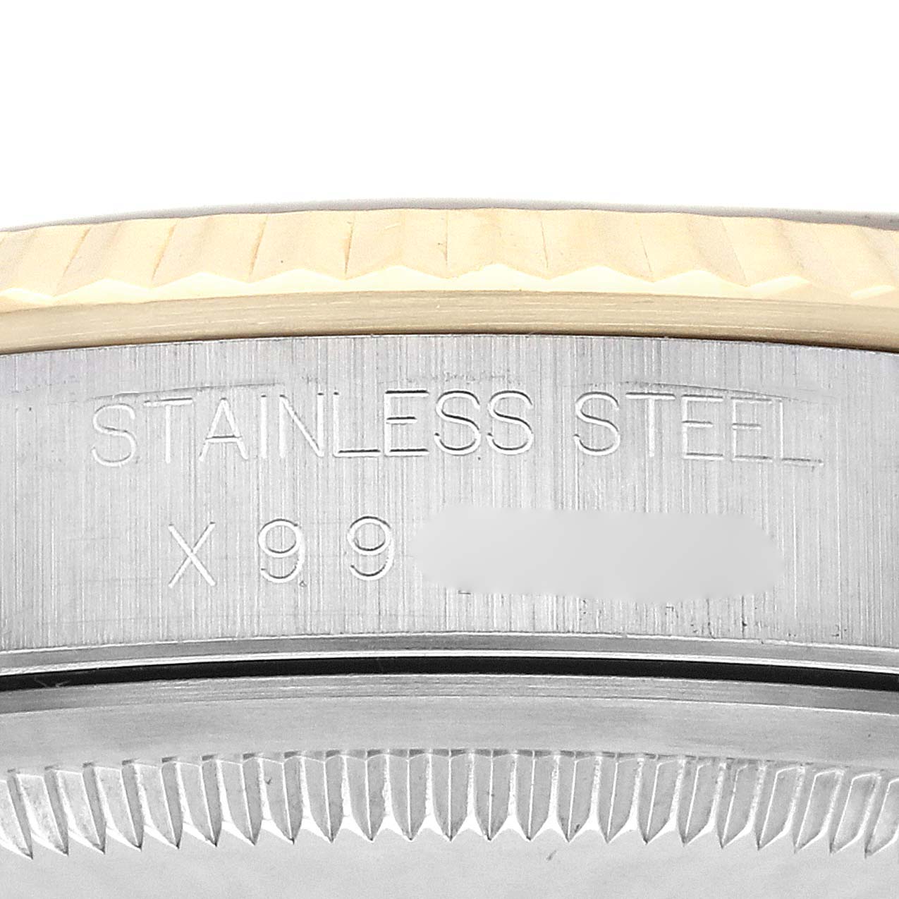 The image shows the side profile of the Rolex Datejust 16233 Men's Steel and Gold (two tone) Champagne Dial 16233 Men's Steel and Gold (two tone) Champagne Dial, highlighting the engraved text on the stainless steel case.