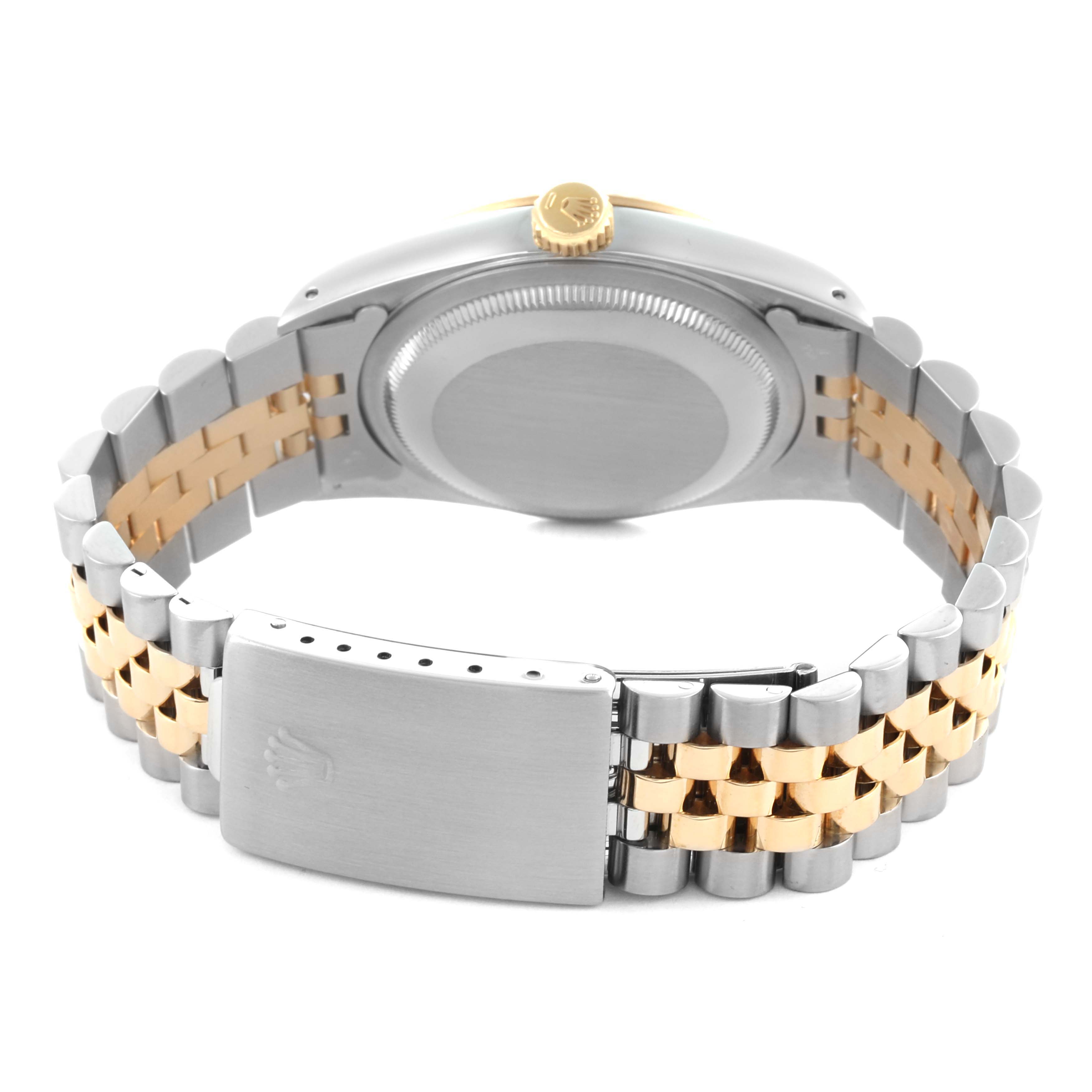 The image shows the back view of a Rolex Datejust 16233 Men's Steel and Gold (two tone) Champagne Dial 16233 Men's Steel and Gold (two tone) Champagne Dial, highlighting the case back and two-tone bracelet with the clasp.