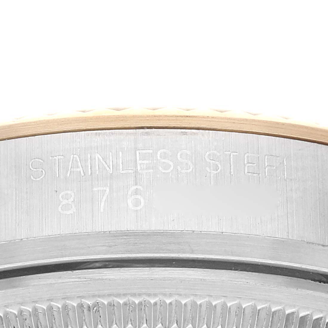 The image shows a close-up of the side of a Vintage Collection Rolex watch, highlighting the engraved stainless steel and model number.