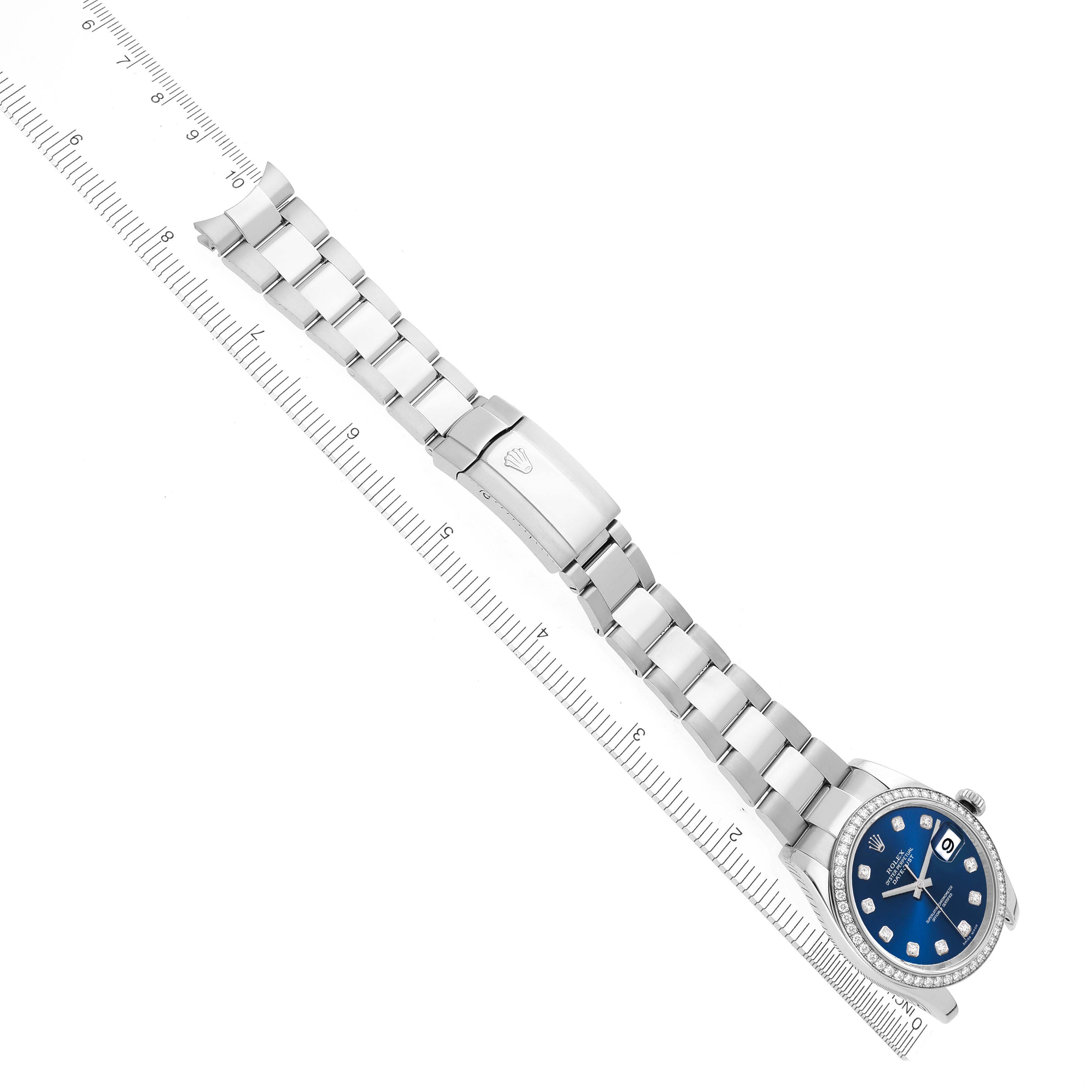 The Rolex Datejust 116244 Men's Stainless Steel Blue Dial 116244 Men's Stainless Steel Blue Dial watch is shown at a diagonal angle, displaying the bracelet, clasp, case, and diamond-set blue dial.