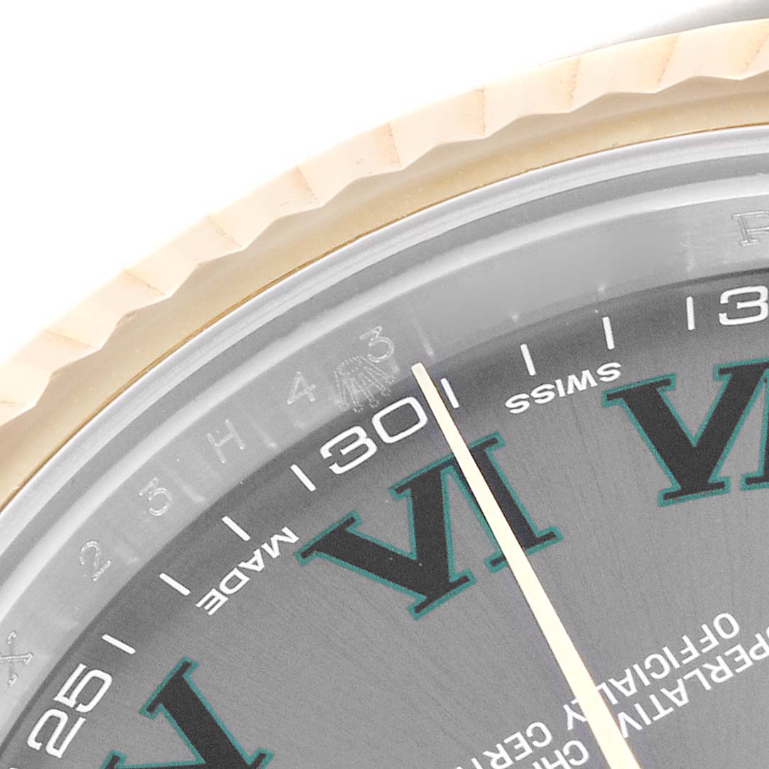 The image shows a close-up angle of the Rolex Datejust 41 116333 Men's Steel and Gold (two tone) Grey Dial 116333 Men's Steel and Gold (two tone) Grey Dial's bezel, dial, and part of the hand.