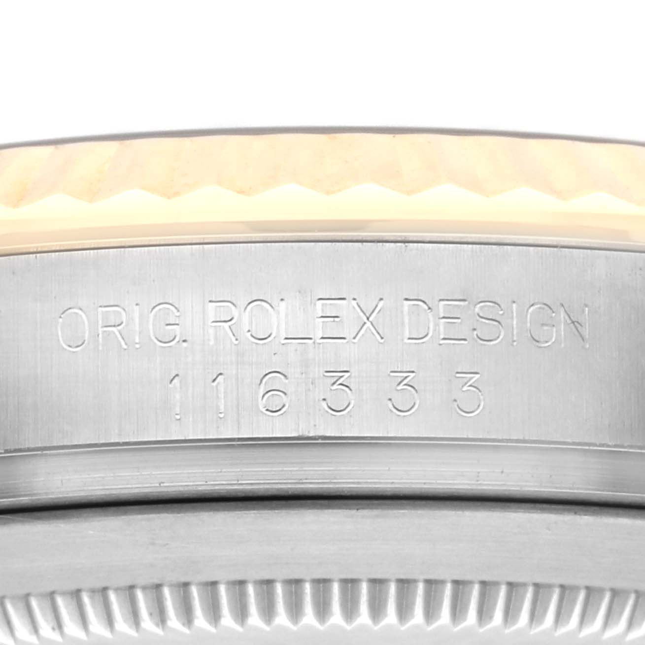 The image shows a close-up of the side of the Rolex Datejust 41 116333 Men's Steel and Gold (two tone) Grey Dial 116333 Men's Steel and Gold (two tone) Grey Dial, highlighting its engraved model number and part of the bezel.