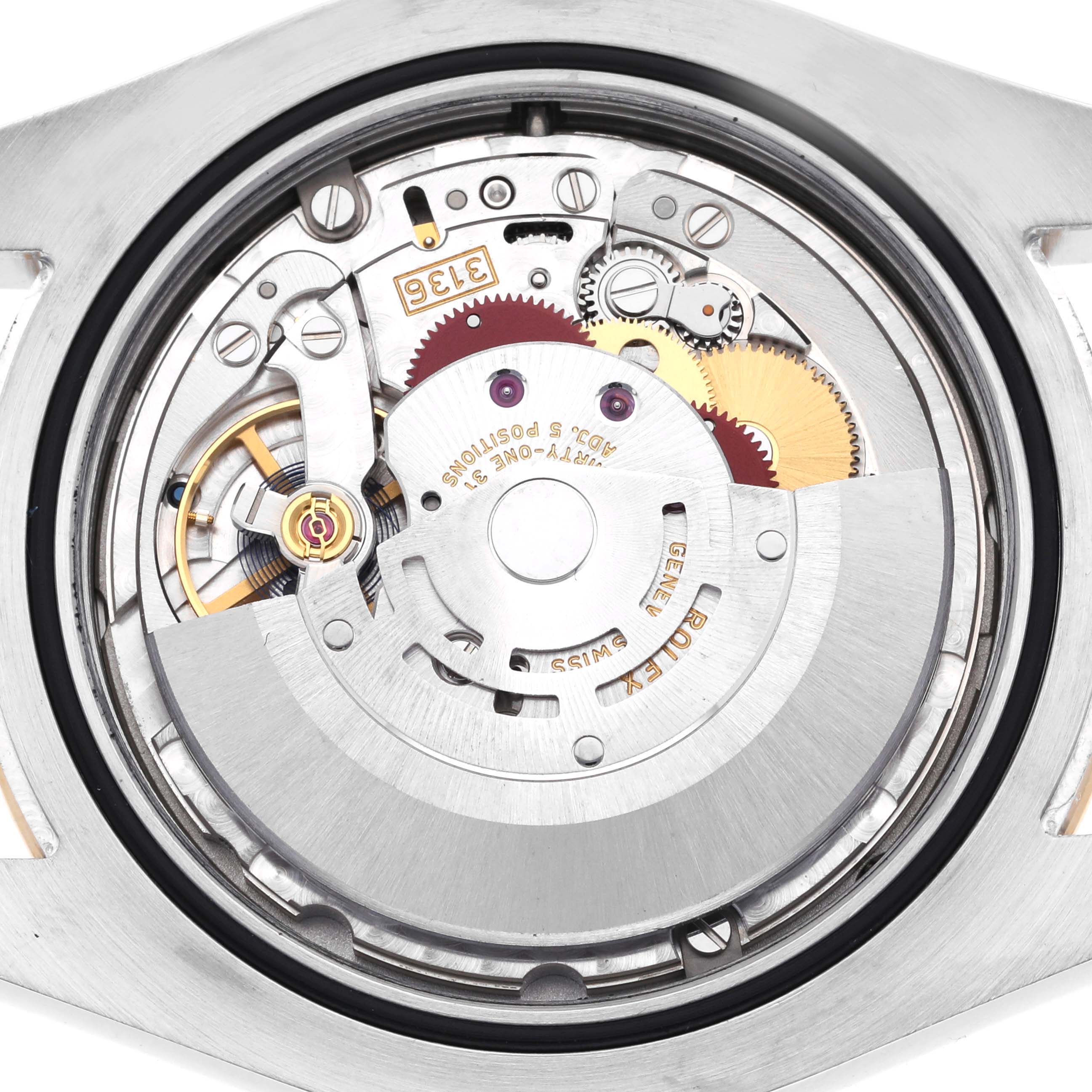 The image shows the inner movement mechanism of the Rolex Datejust 41 116333 Men's Steel and Gold (two tone) Grey Dial 116333 Men's Steel and Gold (two tone) Grey Dial from a top-down angle, highlighting gears and components.