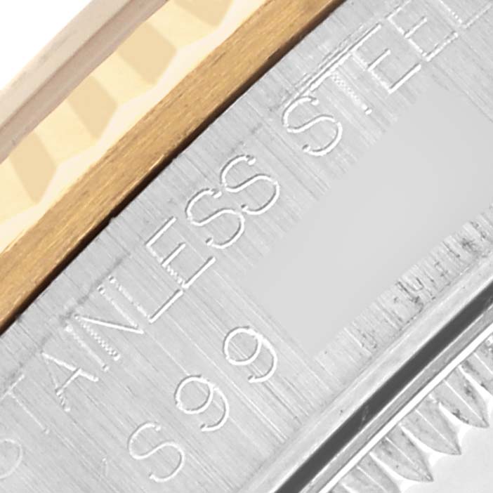 The image shows a close-up of the bezel and edge of a Mid-Size Rolex watch, highlighting its stainless steel and gold parts.