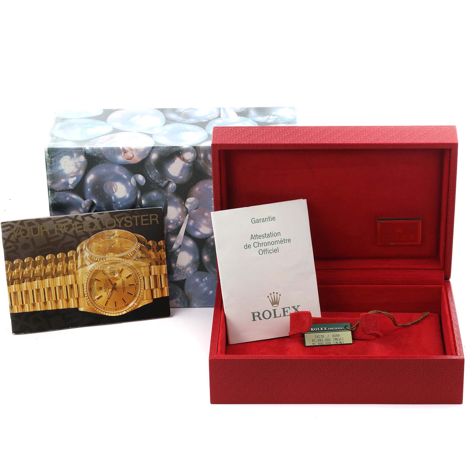 The image shows the packaging and accessories of a Rolex President 78278 Women's Yellow Gold Champagne Dial 78278 Women's Yellow Gold Champagne Dial watch, including the box, booklet, and tag.