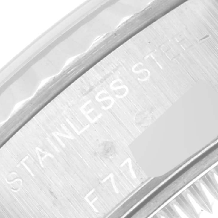 This image shows a close-up view of the stainless steel back casing of a Rolex Datejust 79174 Women's Stainless Steel Pink Dial 79174 Women's Stainless Steel Pink Dial watch, focusing on the engraved details.
