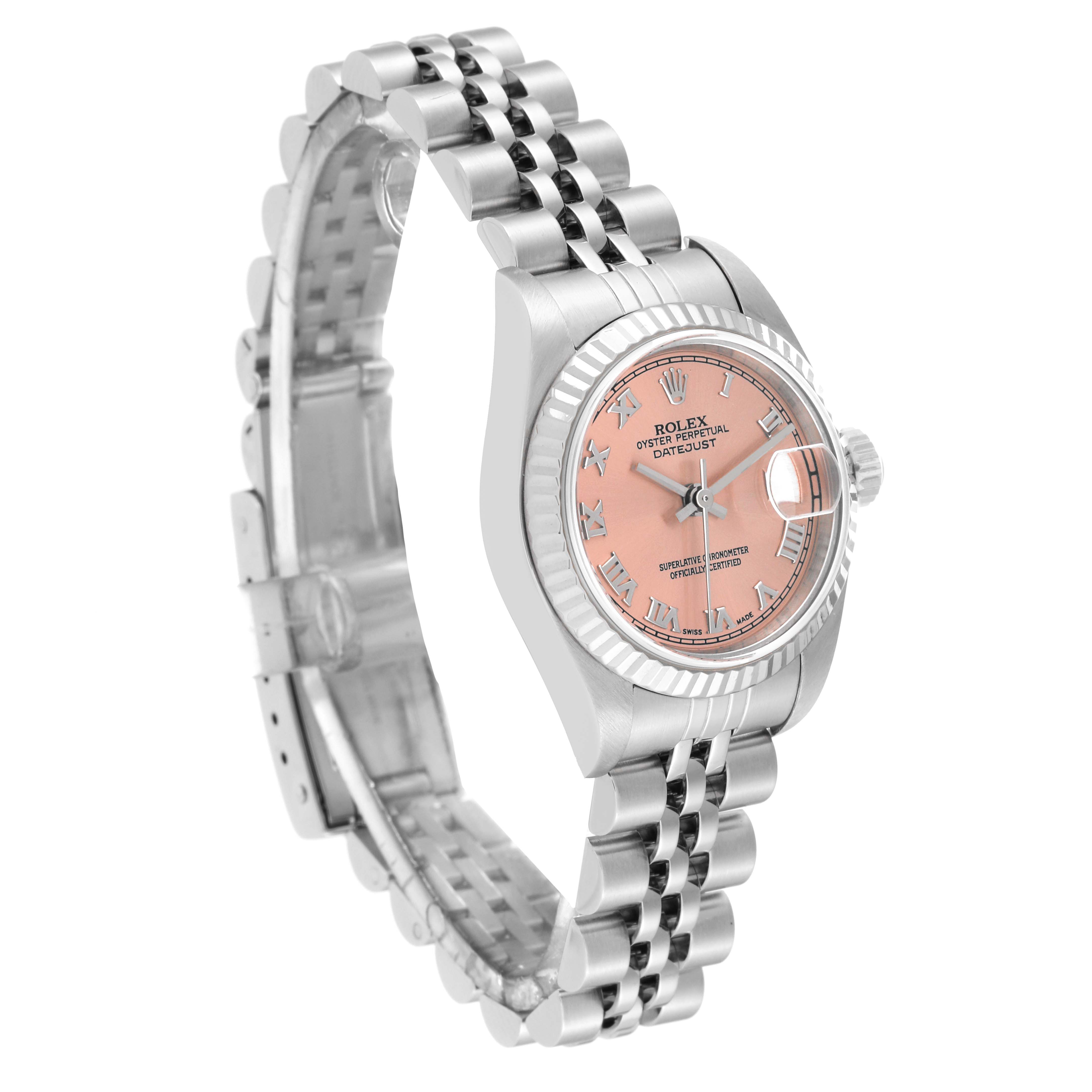 This image shows a Rolex Datejust 79174 Women's Stainless Steel Pink Dial 79174 Women's Stainless Steel Pink Dial watch at a three-quarter angle, highlighting its pink dial, bezel, and stainless steel bracelet.