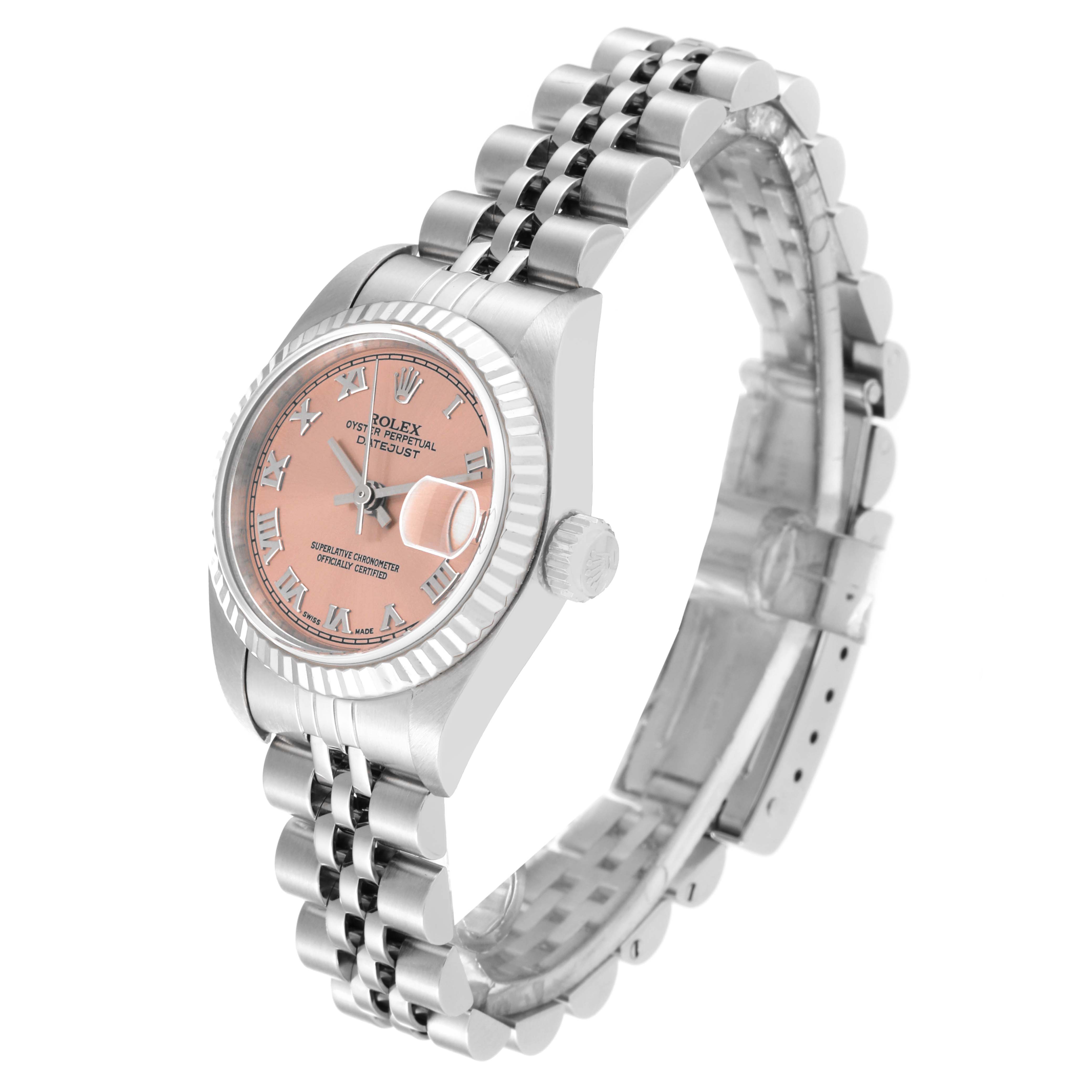 This Rolex Datejust 79174 Women's Stainless Steel Pink Dial 79174 Women's Stainless Steel Pink Dial watch is shown from a slightly angled side view, highlighting the face, bezel, bracelet, and crown.