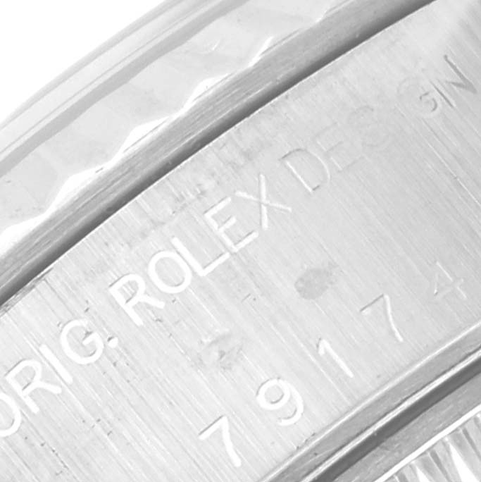 This image shows a close-up of the rehaut or inner bezel on a Rolex Datejust 79174 Women's Stainless Steel Pink Dial 79174 Women's Stainless Steel Pink Dial watch.