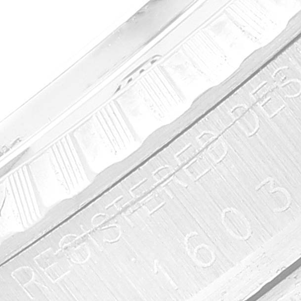 This image shows a close-up of the engraved text on the case of the Rolex Vintage Collection 1603 Men's Stainless Steel Silver Dial 1603 Men's Stainless Steel Silver Dial model.