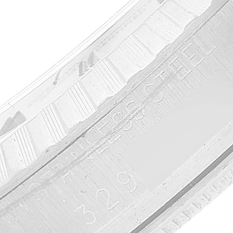 This image shows a close-up of the bezel and inner rim with engravings on the Rolex Vintage Collection 1603 Men's Stainless Steel Silver Dial 1603 Men's Stainless Steel Silver Dial model watch.