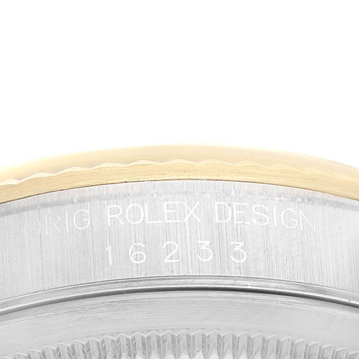 This close-up image shows a side angle of the Rolex Datejust 16233 Men's Steel and Gold (two tone) Champagne Dial 16233 Men's Steel and Gold (two tone) Champagne Dial model, highlighting the engraved model number 16233 and bezel.
