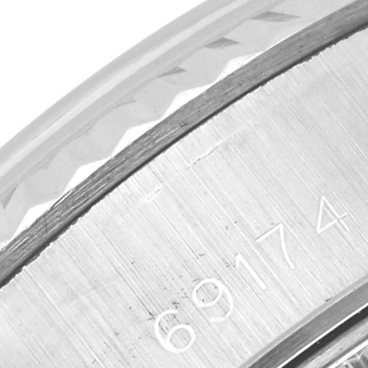 This close-up image shows the engraving on the case back of a Rolex Datejust 69174 Women's Stainless Steel Silver Dial 69174 Women's Stainless Steel Silver Dial model.