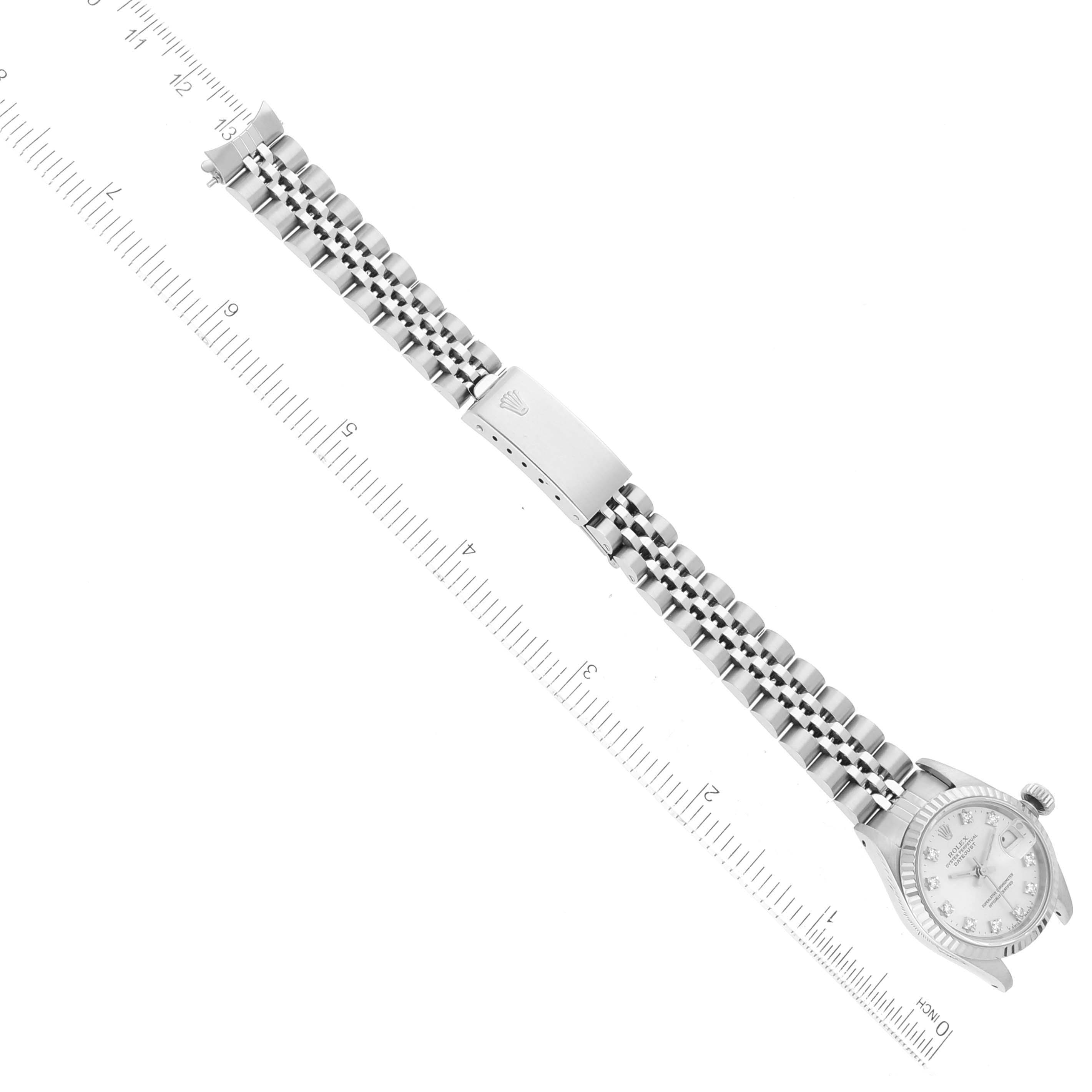 The image shows a top-view of a Rolex Datejust 69174 Women's Stainless Steel Silver Dial 69174 Women's Stainless Steel Silver Dial watch with a focus on the full bracelet and clasp, measured against a ruler.