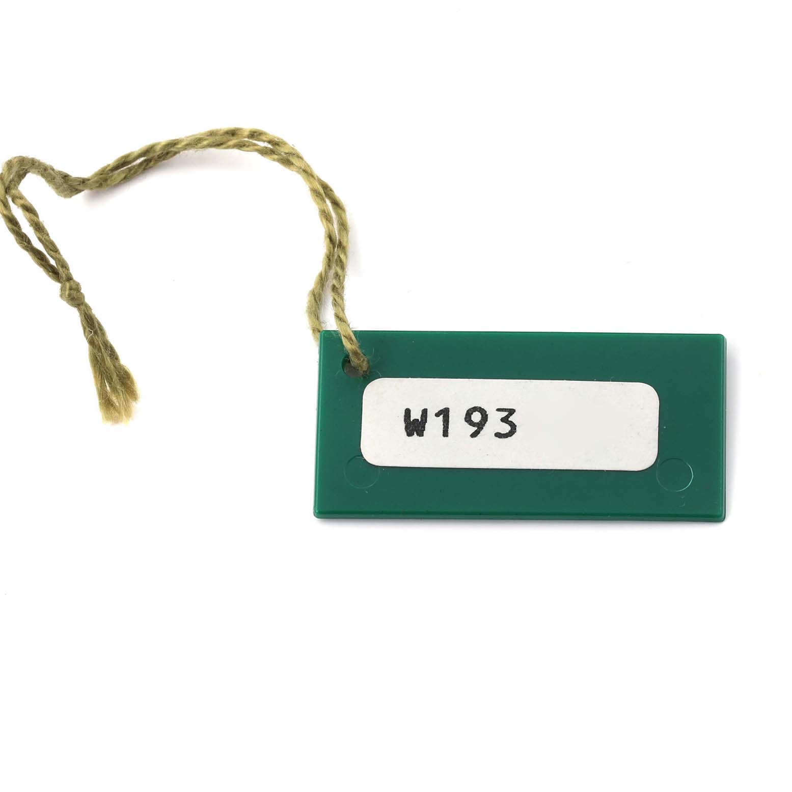 The image shows a green tag accessory for a Rolex Datejust 69174 Women's Stainless Steel Grey Dial 69174 Women's Stainless Steel Grey Dial watch, with "W193" written on it.