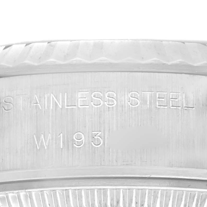 The image shows a close-up of the side of the Rolex Datejust 69174 Women's Stainless Steel Grey Dial 69174 Women's Stainless Steel Grey Dial watch, focusing on the edge and the "Stainless Steel" engraving.