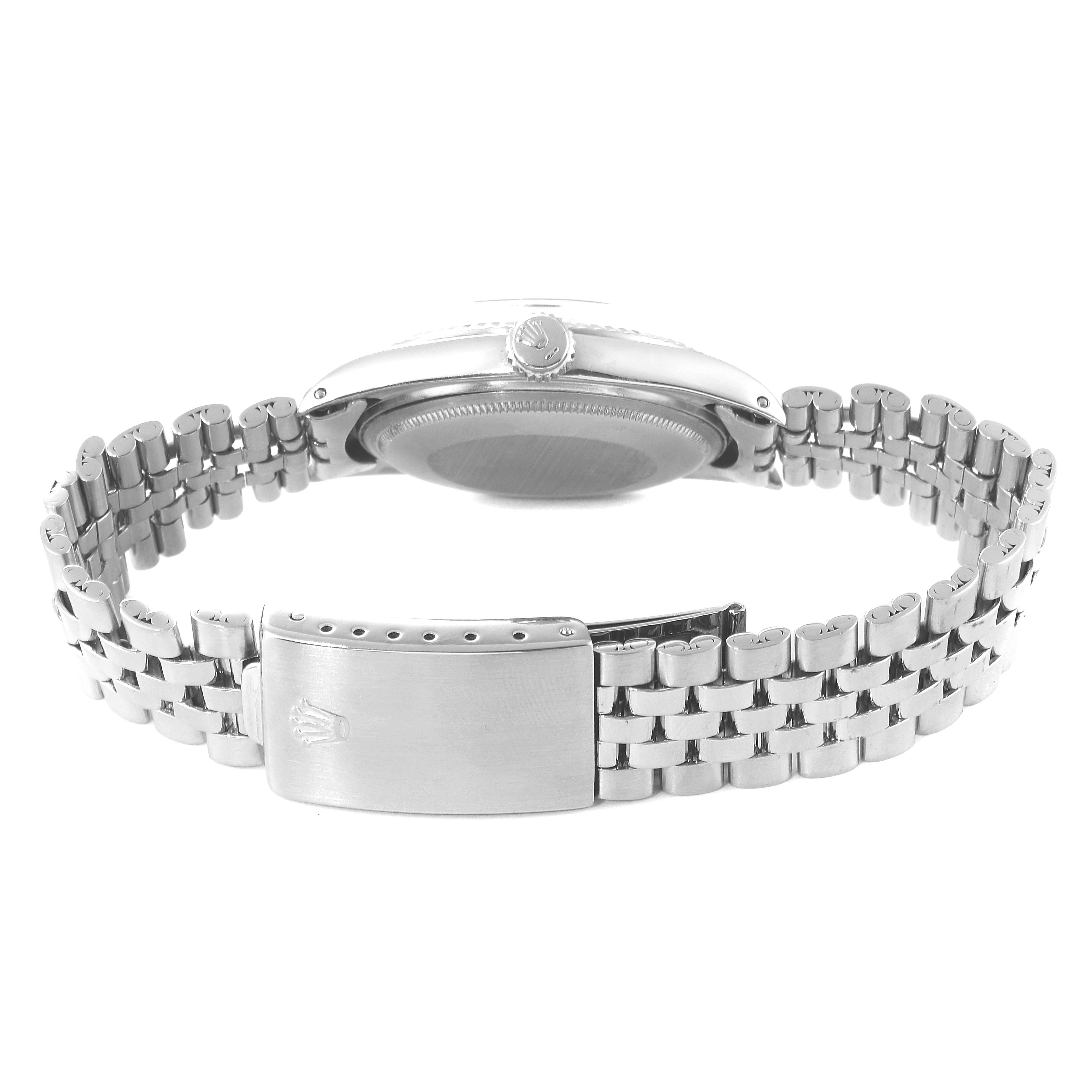 The image shows the backside of a Rolex Vintage Collection 1601 Men's Stainless Steel Silver Dial 1601 Men's Stainless Steel Silver Dial watch with the bracelet and clasp visible.