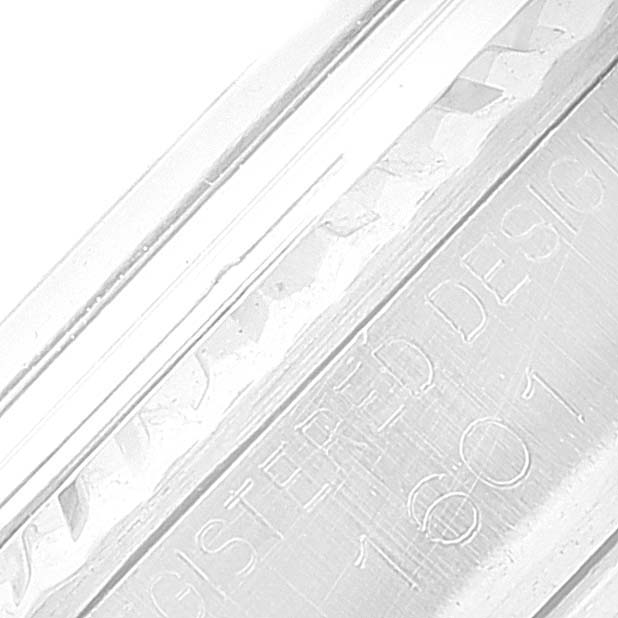 Close-up of the Rolex Vintage Collection 1601 Men's Stainless Steel Silver Dial 1601 Men's Stainless Steel Silver Dial model's engraved casing, showing "REGISTERED DESIGN 1601."