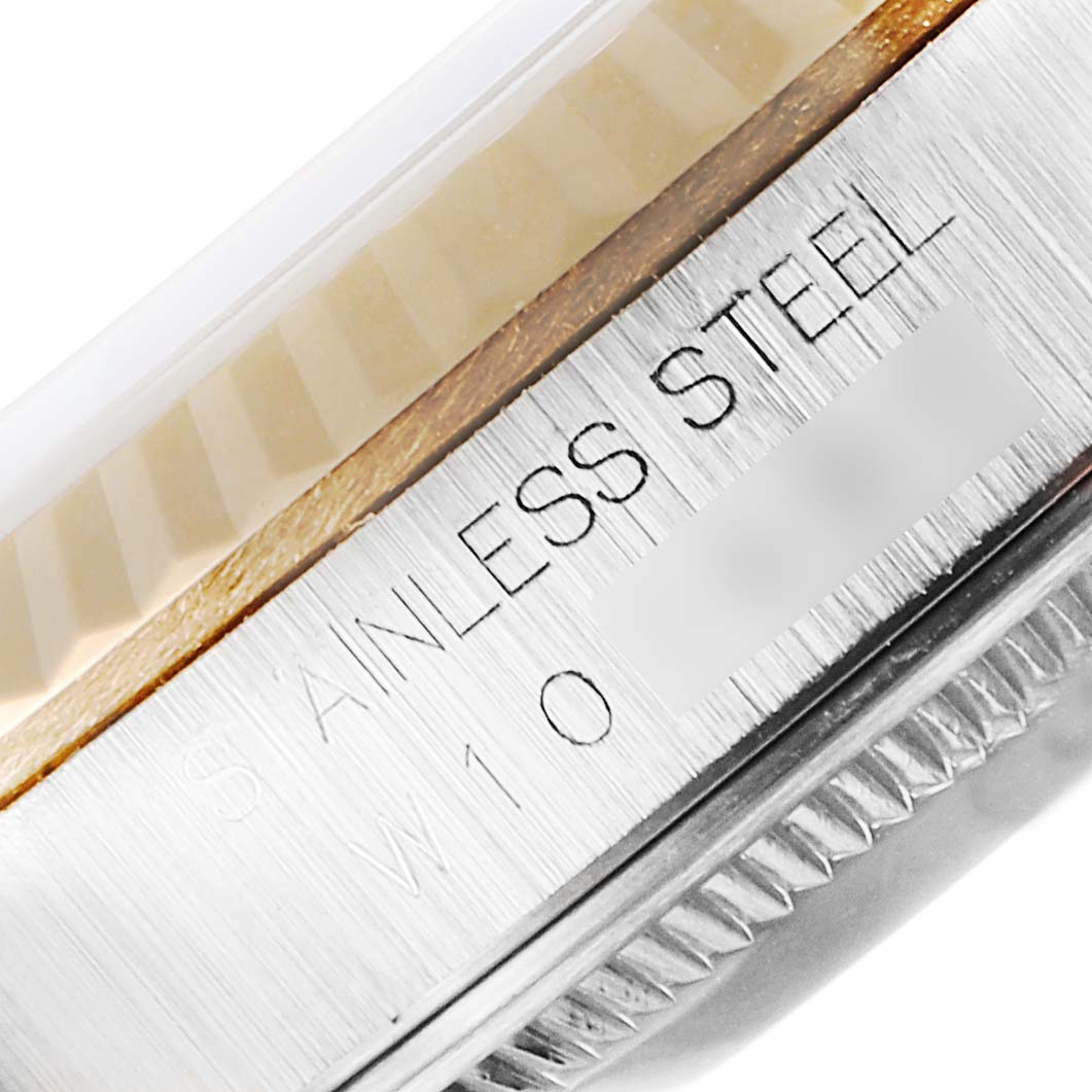 The image shows a close-up angle of the stainless steel rim and part of the fluted bezel of a Rolex Datejust 16233 Men's Steel and Gold (two tone) Champagne Dial 16233 Men's Steel and Gold (two tone) Champagne Dial watch.