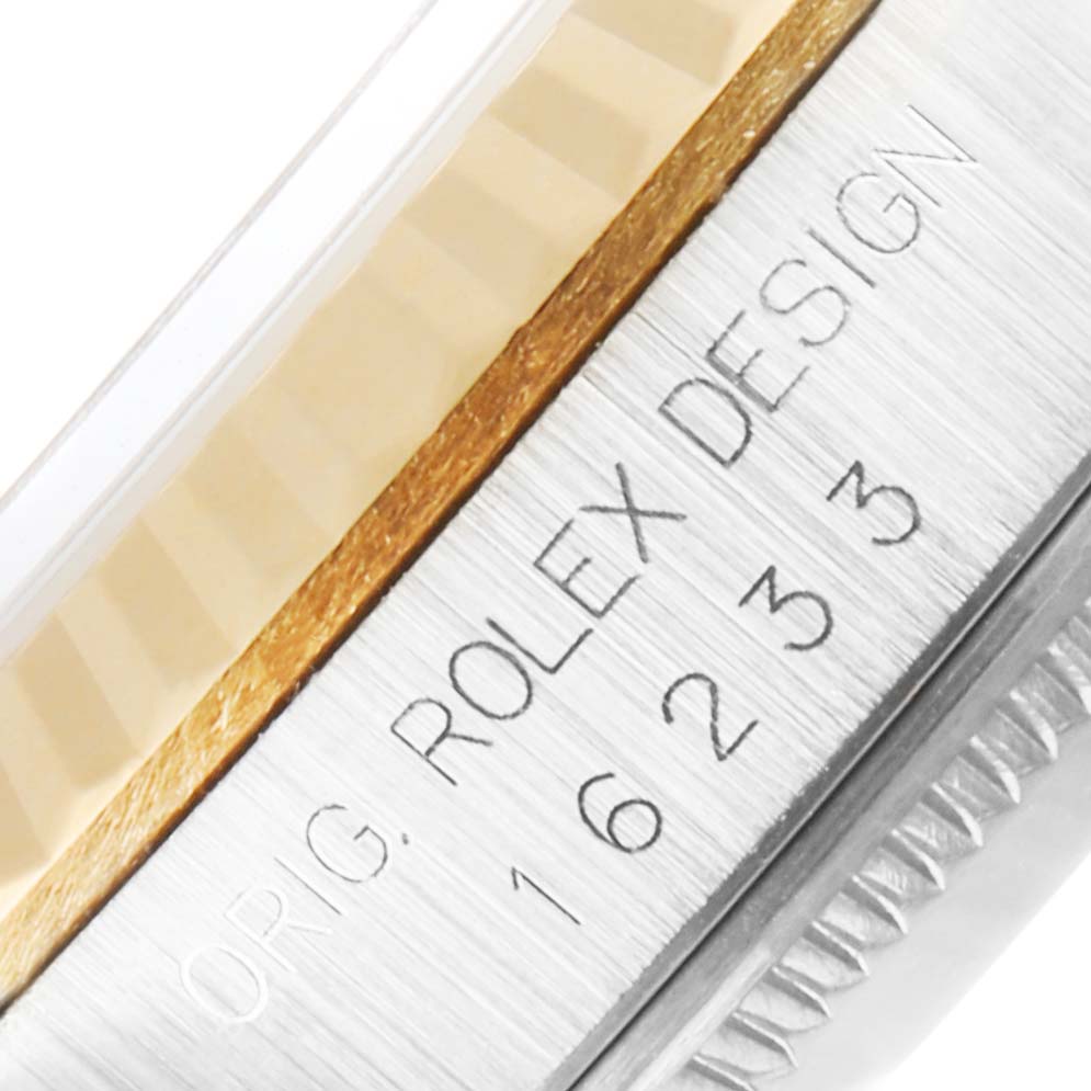 This is a close-up view of the case side of a Rolex Datejust 16233 Men's Steel and Gold (two tone) Champagne Dial 16233 Men's Steel and Gold (two tone) Champagne Dial, showing the engraved model number and "ORIG. ROLEX DESIGN".
