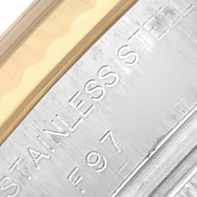 The image shows a close-up of the casing edge with "STAINLESS STEEL" engraved on a Rolex Datejust 179173 Women's Steel and Gold (two tone) Mother of Pearl Dial 179173 Women's Steel and Gold (two tone) Mother of Pearl Dial watch.