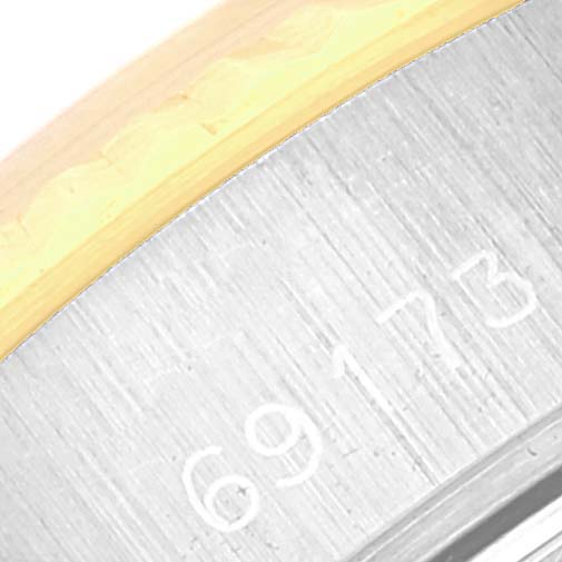 This close-up image shows the model number engraved on the side of a Rolex Datejust 69173 Women's Steel and Gold (two tone) White Dial 69173 Women's Steel and Gold (two tone) White Dial watch.